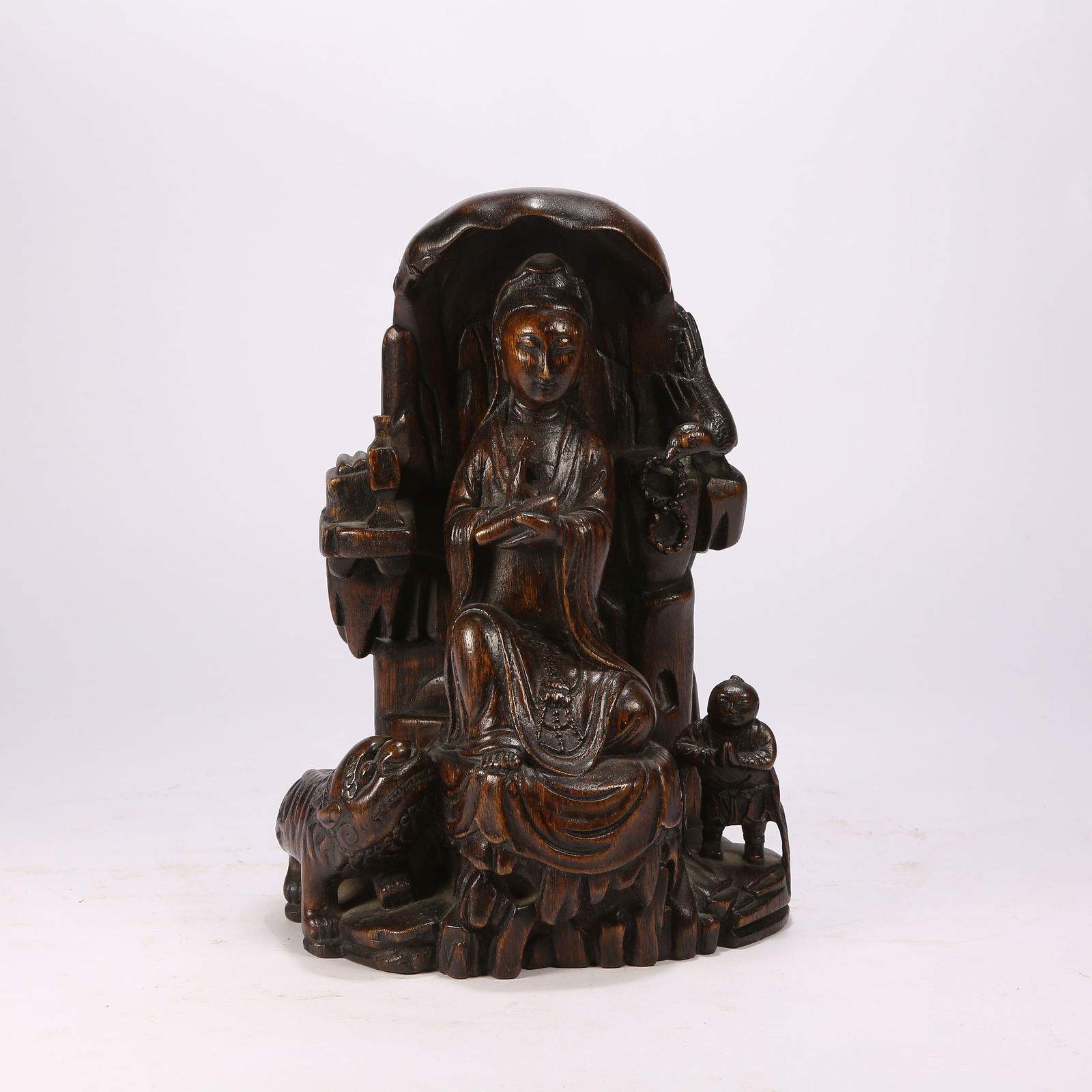 A ZITAN WOOD GUANYIN MOUNTAIN ORNAMENT: Zitan wood Guanyin mountain ornament