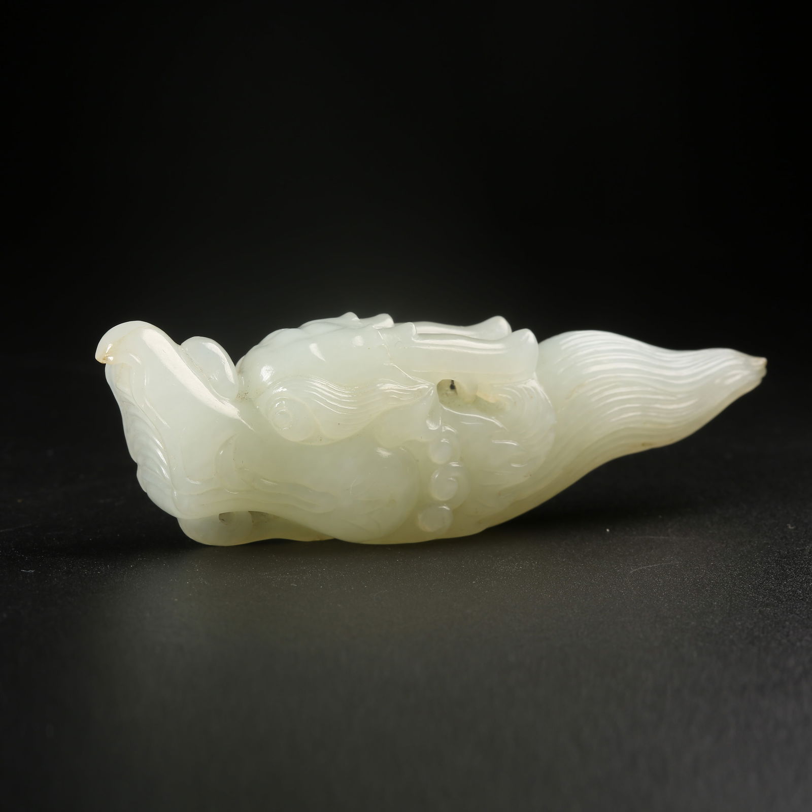 A HETIAN WHITE JADE DRAGON-HEAD PENDANT (1 of 8)