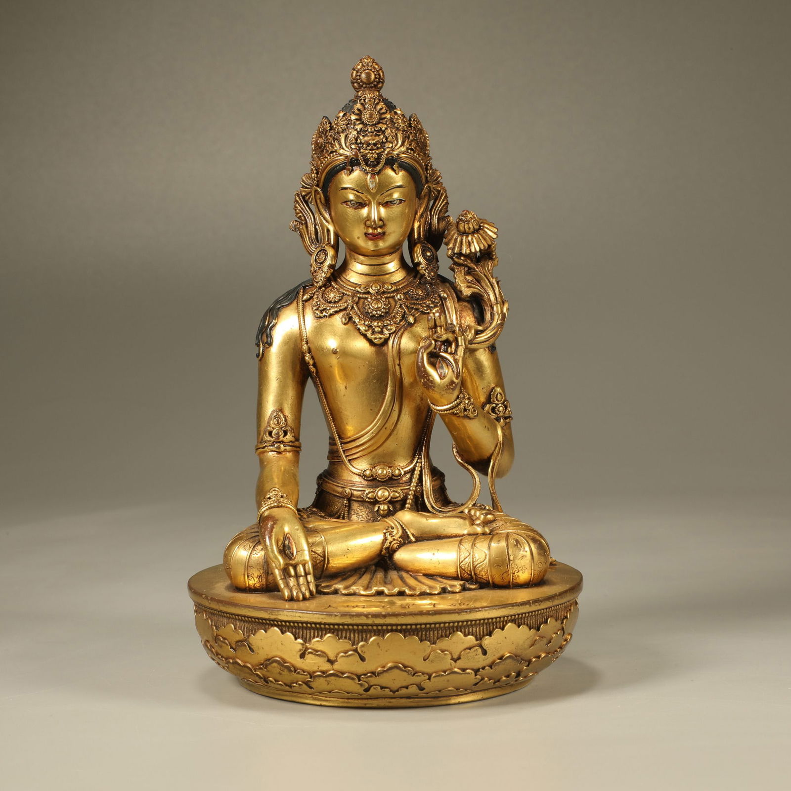A GILT-BRONZE FIGURE OF GUANYIN (1 of 7)