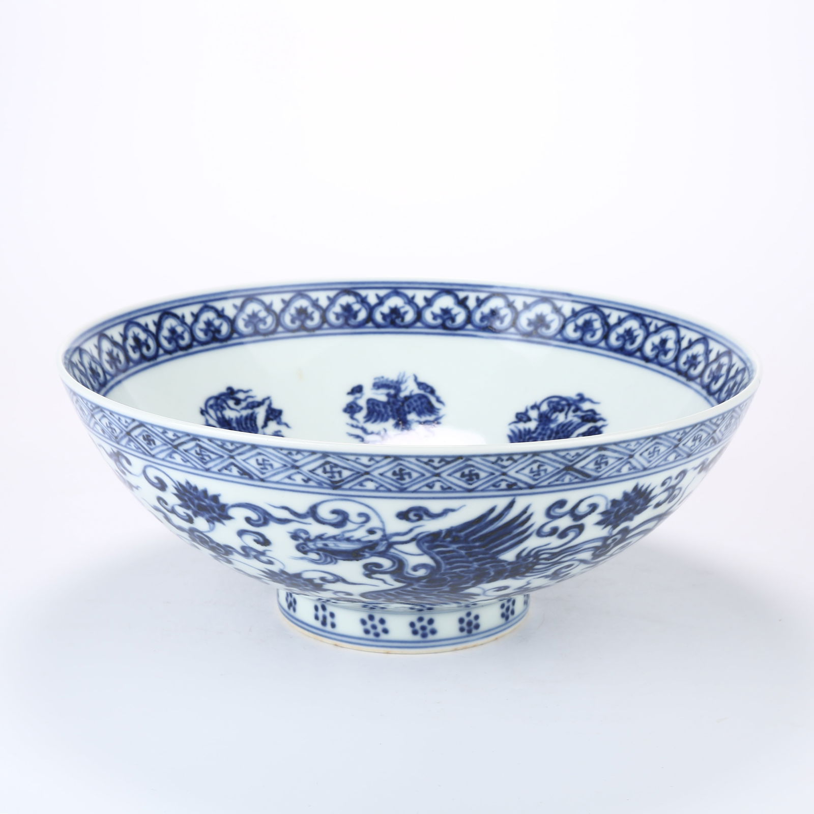 A LARGE BLUE AND WHITE BOWL WITH PHOENIX AMID FLOWERS DESIGN (1 of 9)