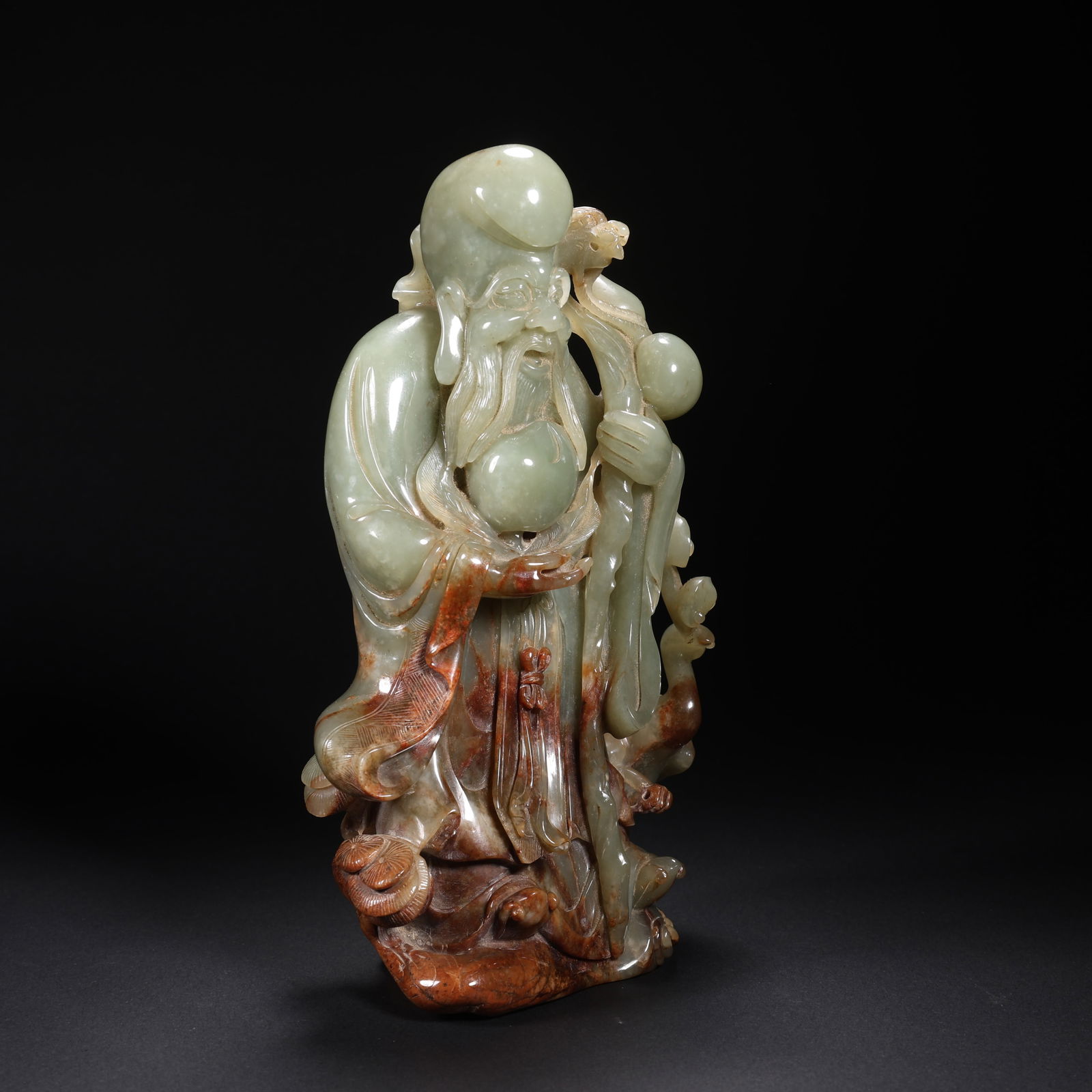 A HETIAN JADE LONGEVITY STAR FIGURE WITH DRAGON STAFF (1 of 9)