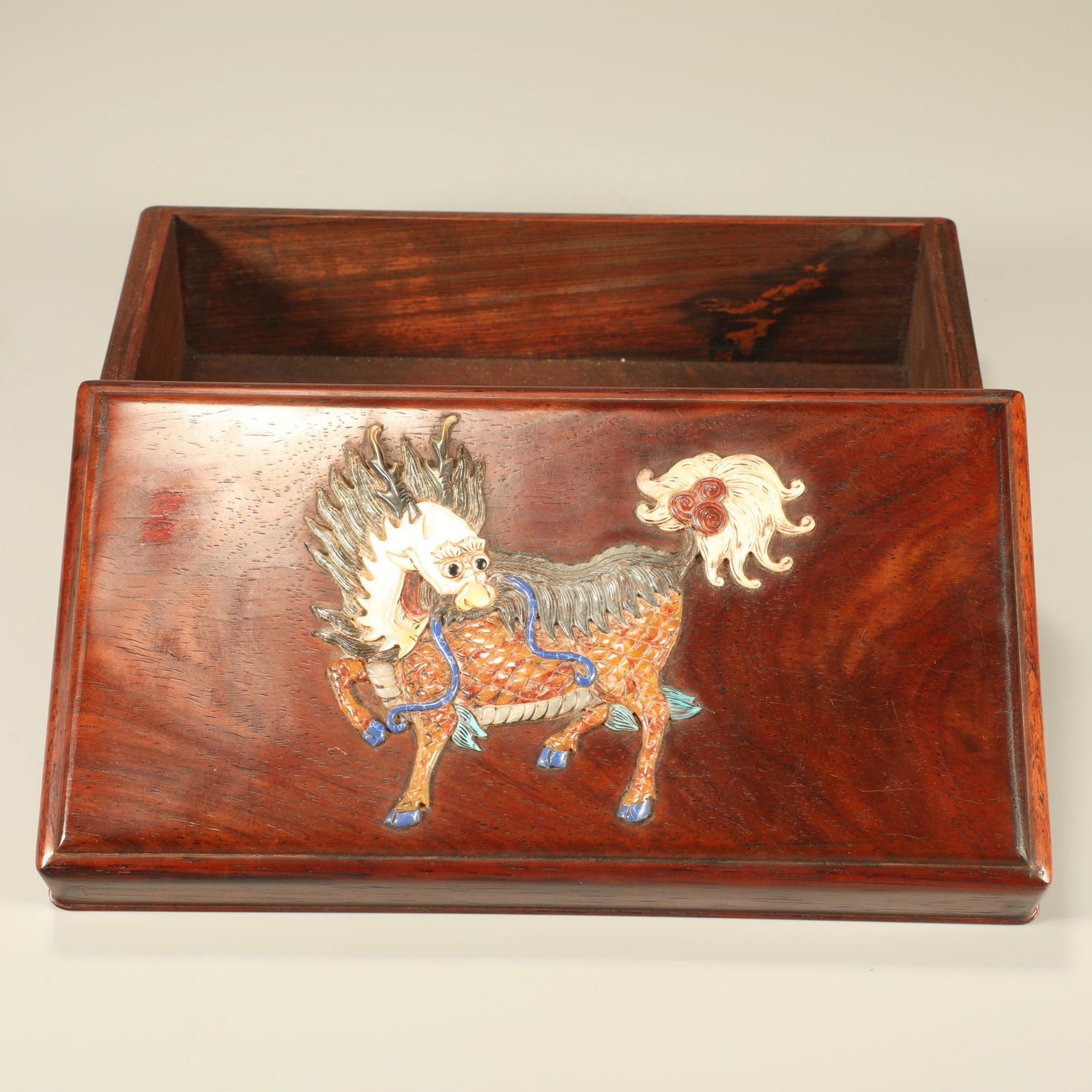A HUANGHUALI WOOD COVERED BOX INLAID WITH HARDSTONES, FEATURING QILIN MOTIFS: Huanghuali wood covered box inlaid with hardstones, featuring qilin motifs