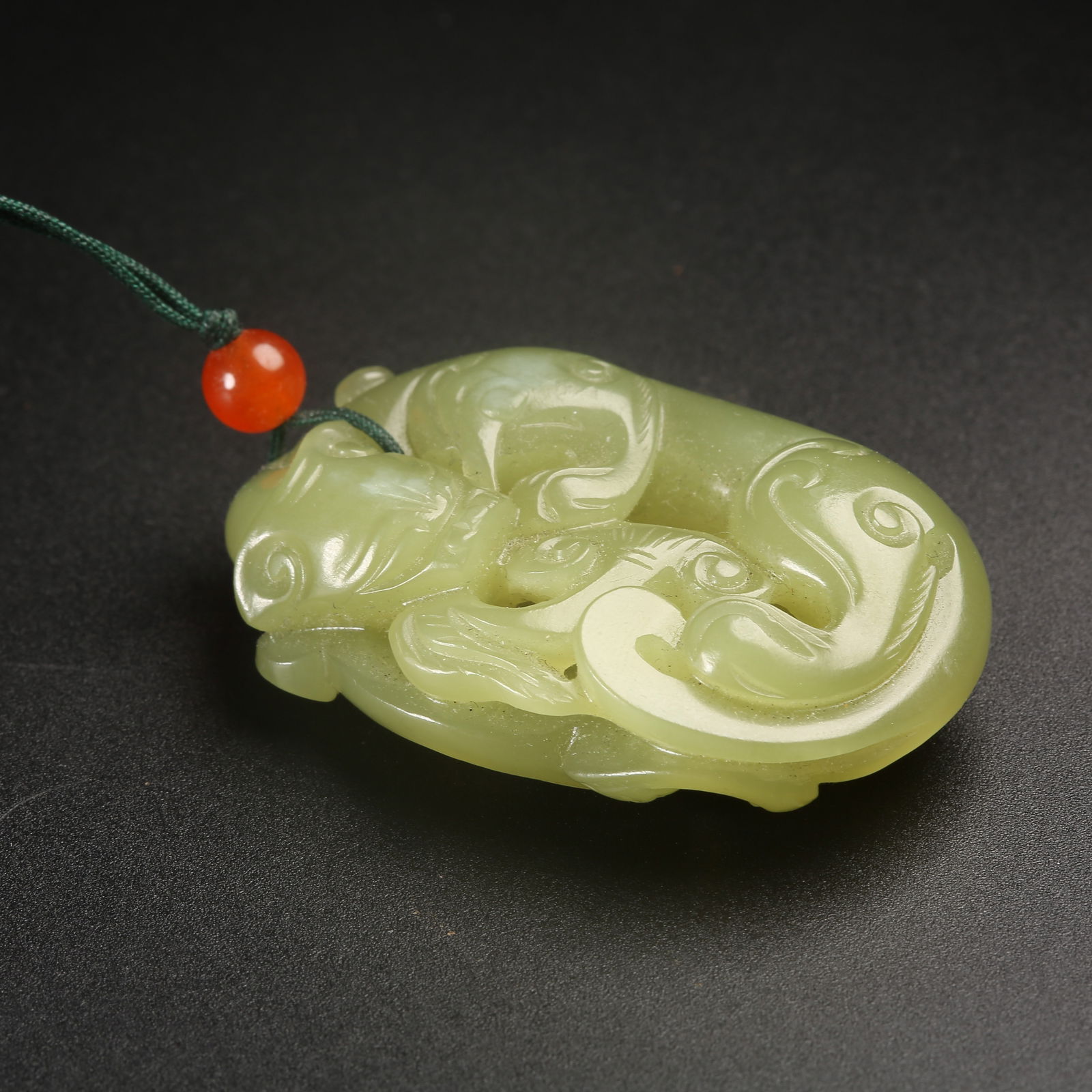A HETIAN JADE CHI-DRAGON PENDANT (1 of 8)