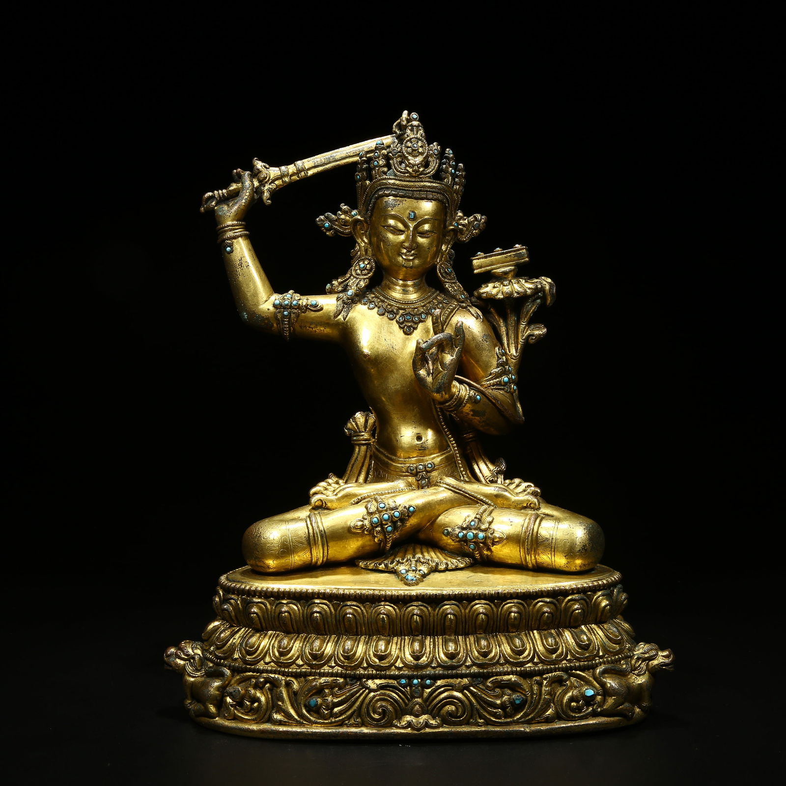 A GILT BRONZE STATUE OF MANJUSHRI INLAID WITH TURQUOISE: Gilt Bronze Statue of Manjushri Inlaid with Turquoise