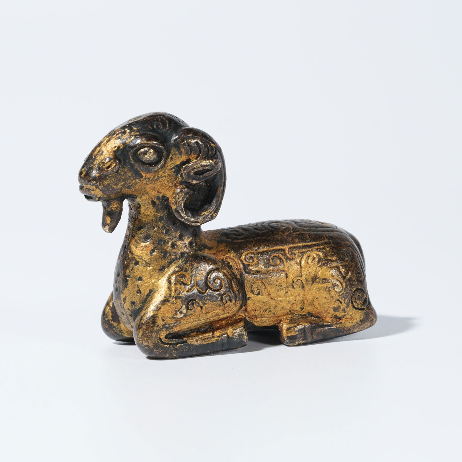 A GILT-BRONZE RAM FIGURE (1 of 9)