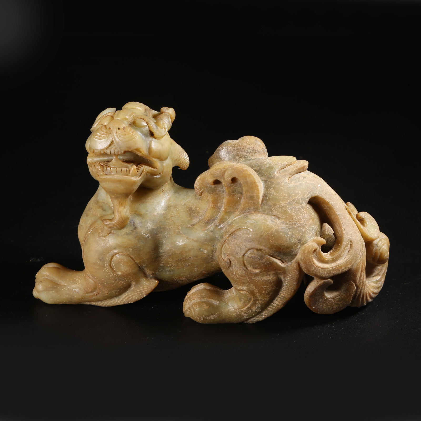 A ARCHAIC JADE AUSPICIOUS BEAST ORNAMENT (1 of 8)