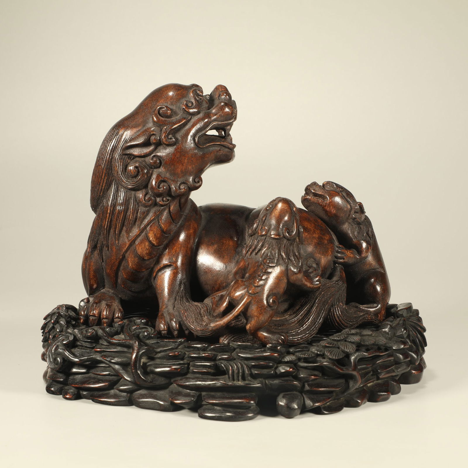 A AGARWOOD CARVED AUSPICIOUS BEAST FIGURE: Agarwood Carved Auspicious Beast Figure