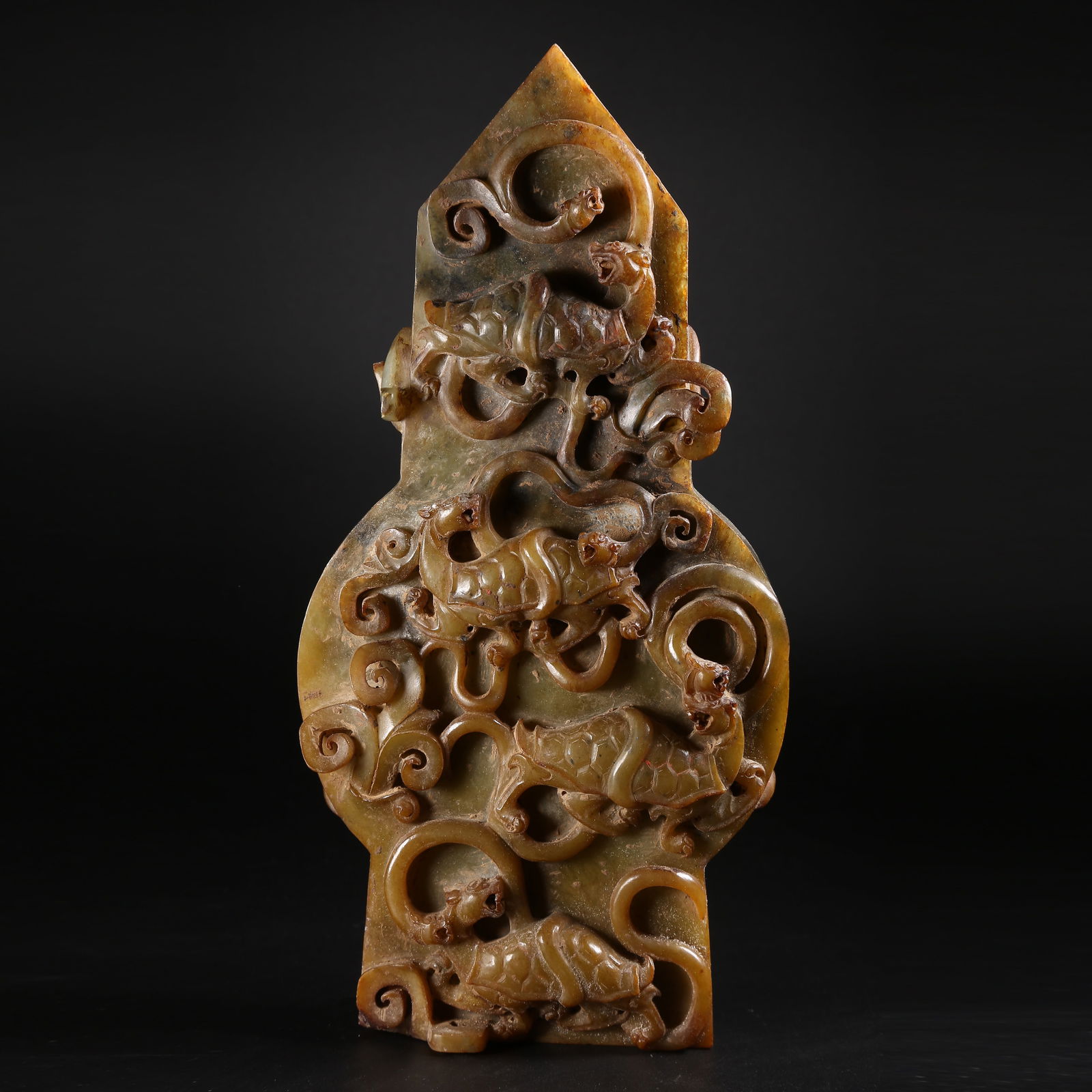 A ARCHAIC JADE GUI WITH COILED DRAGON MOTIF: Archaic jade gui with coiled dragon motif