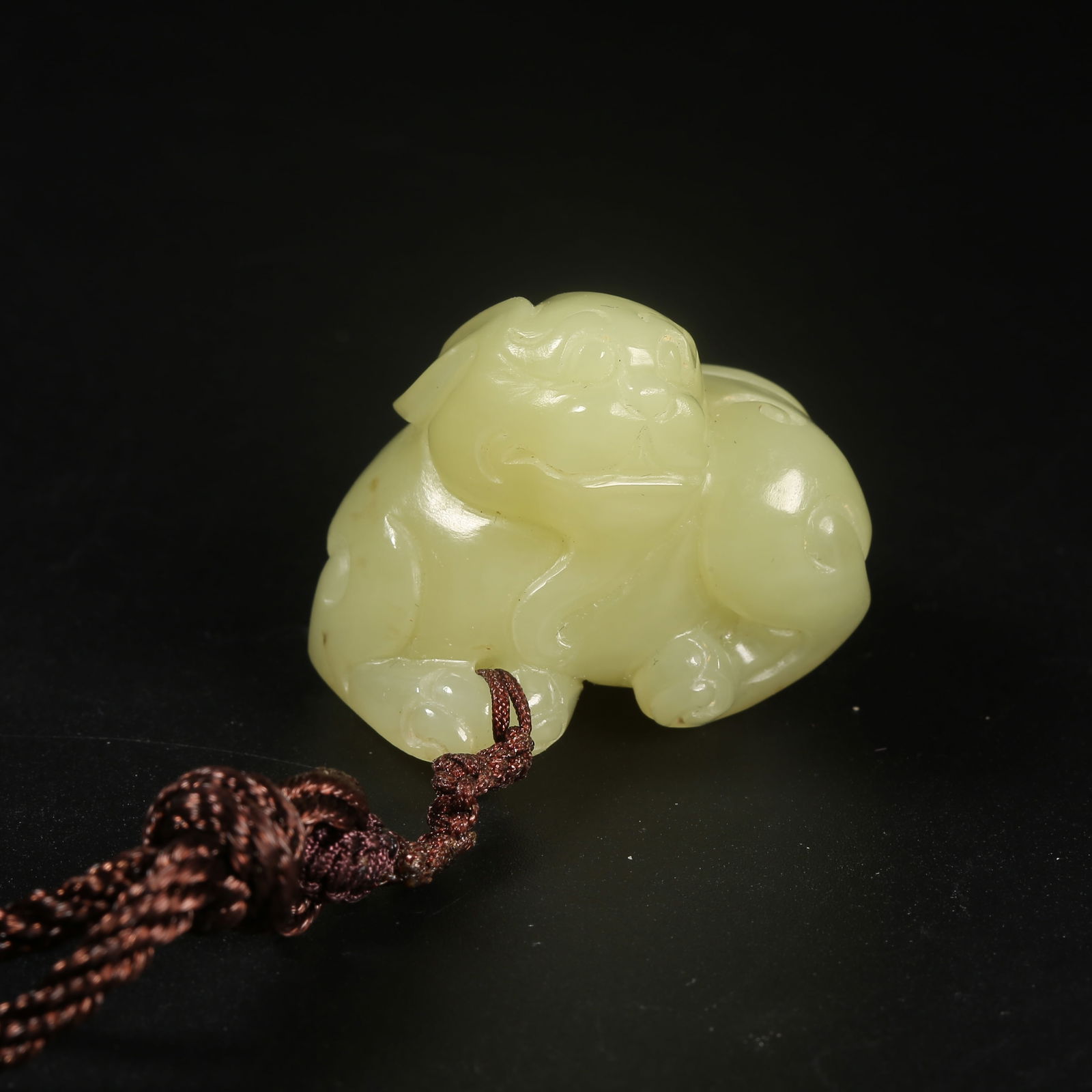 A HETIAN YELLOW JADE AUSPICIOUS BEAST PENDANT (1 of 8)