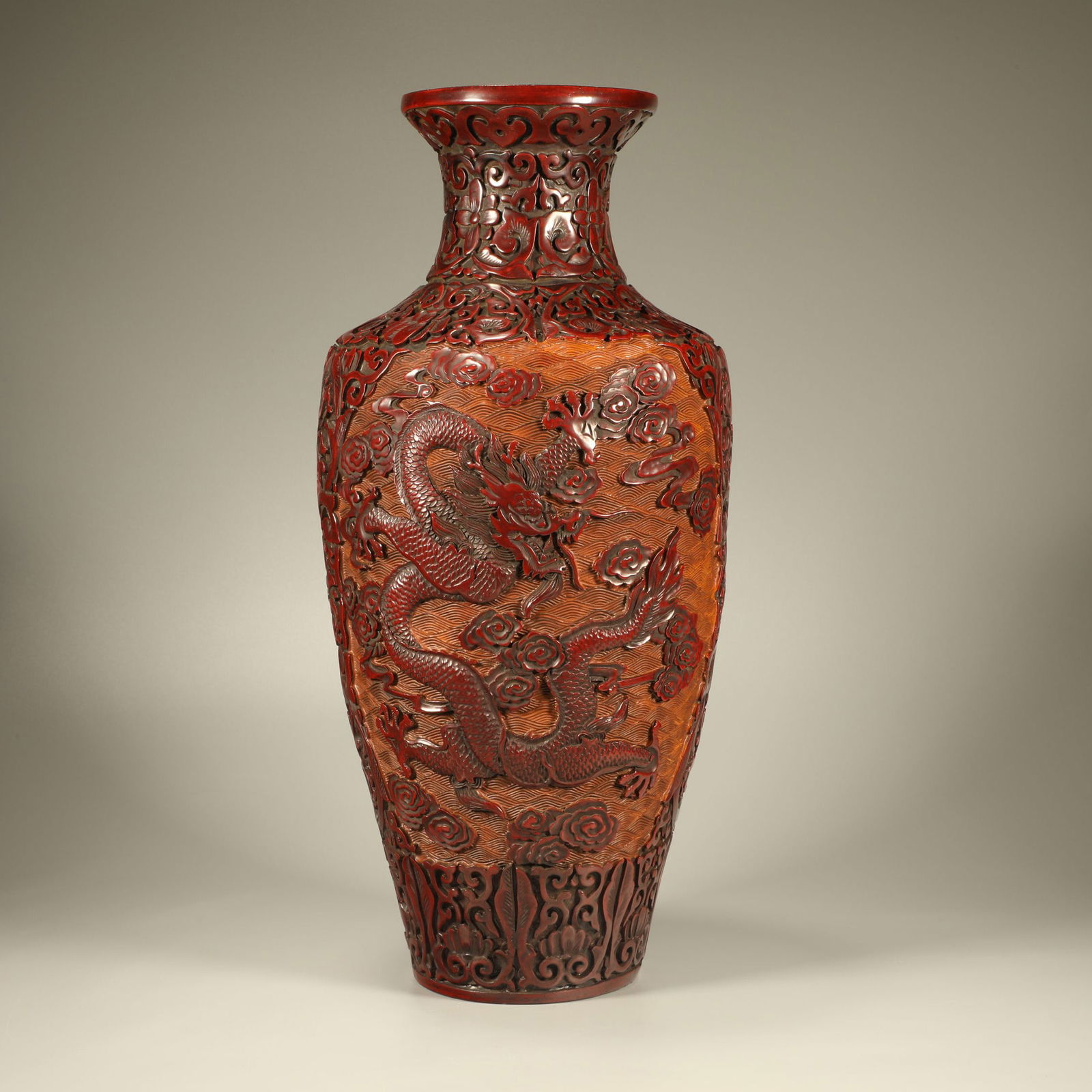 A LACQUER VASE WITH CLOUD-AND-DRAGON AND FLOWER MOTIF (1 of 7)