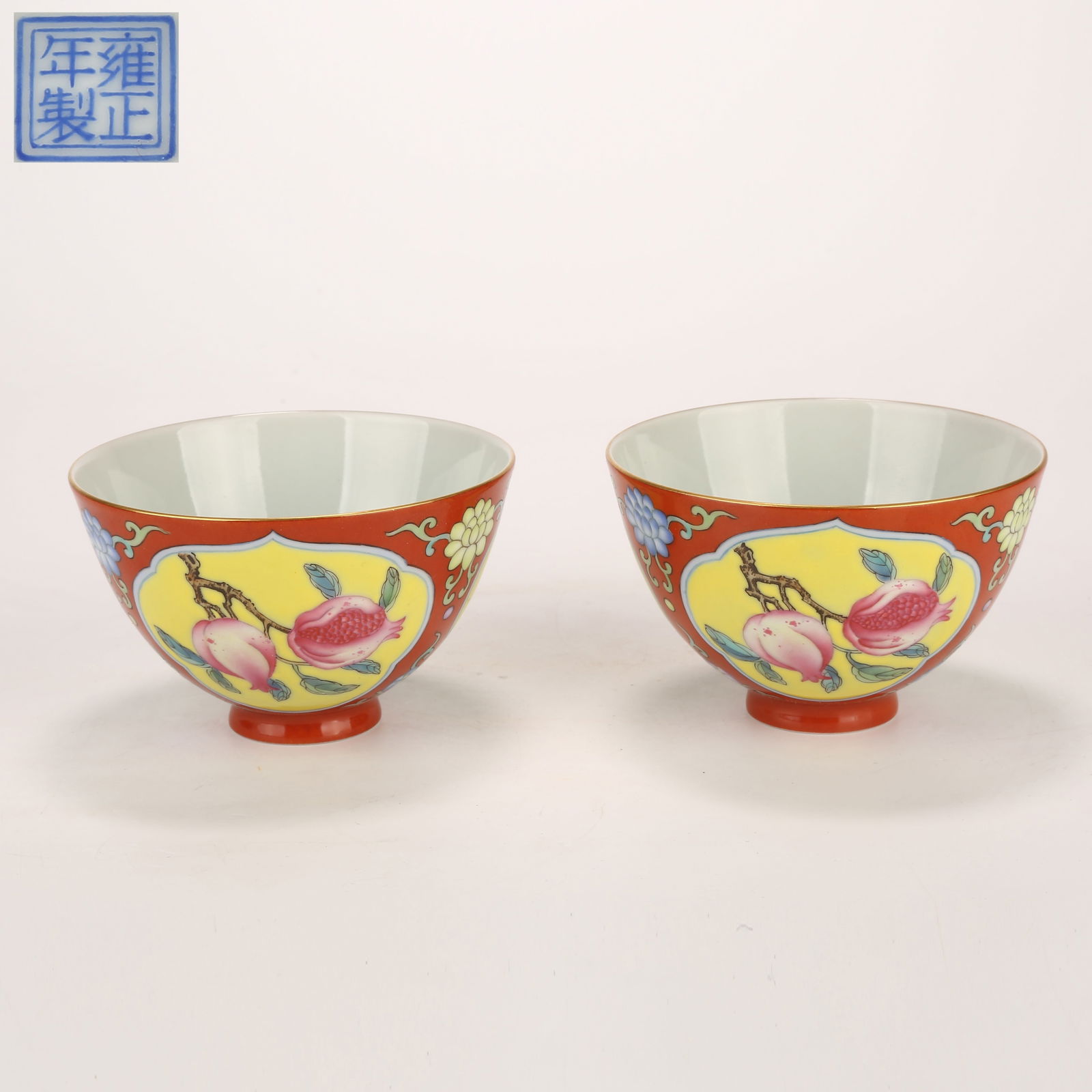 A SET OF CORAL-RED GROUND ENAMELLED CUPS WITH PANELLED AUSPICIOUS FRUIT DESIGN (1 of 9)