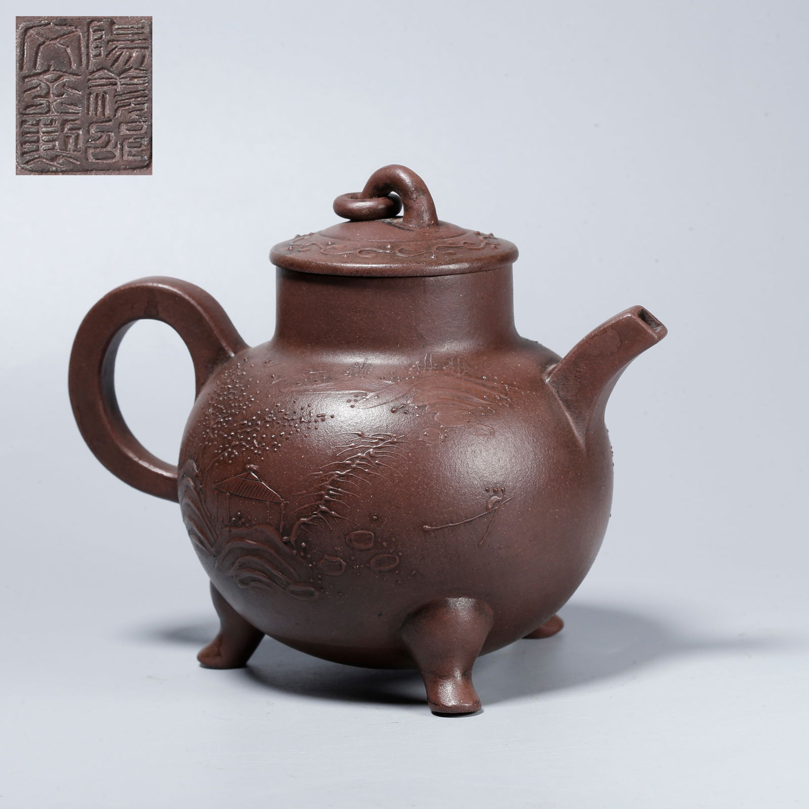 A ZISHA TRIPOD EWER WITH CARVED LANDSCAPE DESIGN: Zisha Tripod Ewer with Carved Landscape Design