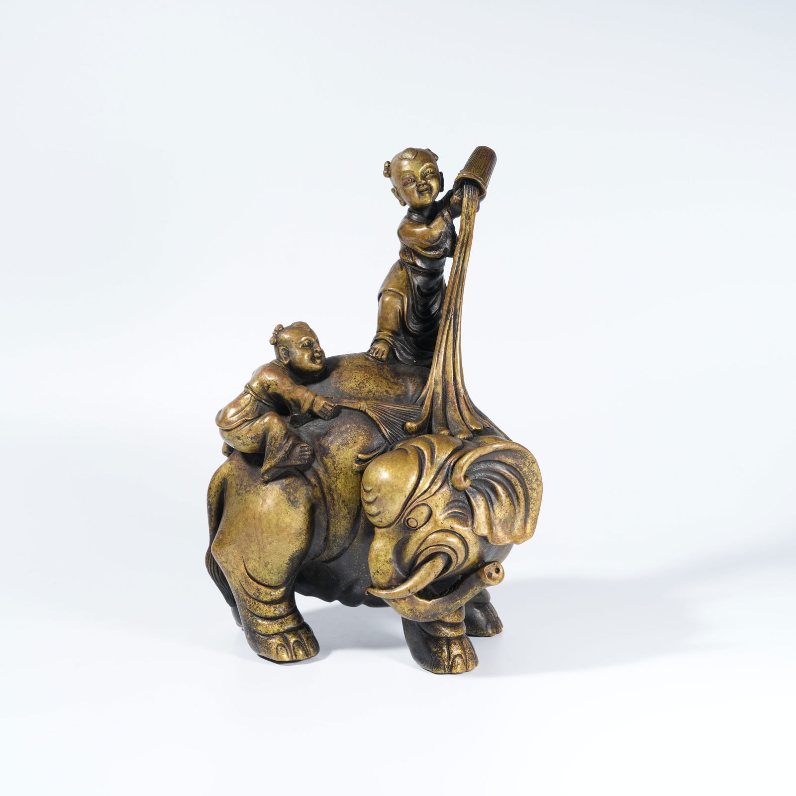 A GILT-BRONZE FIGURE OF BOY WASHING AN ELEPHANT (1 of 10)