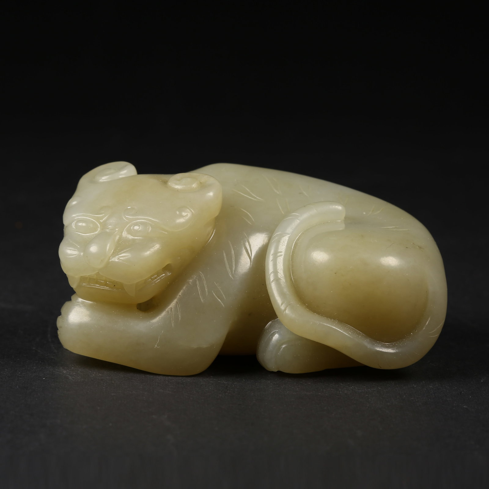 A HETIAN JADE AUSPICIOUS BEAST ORNAMENT (1 of 8)
