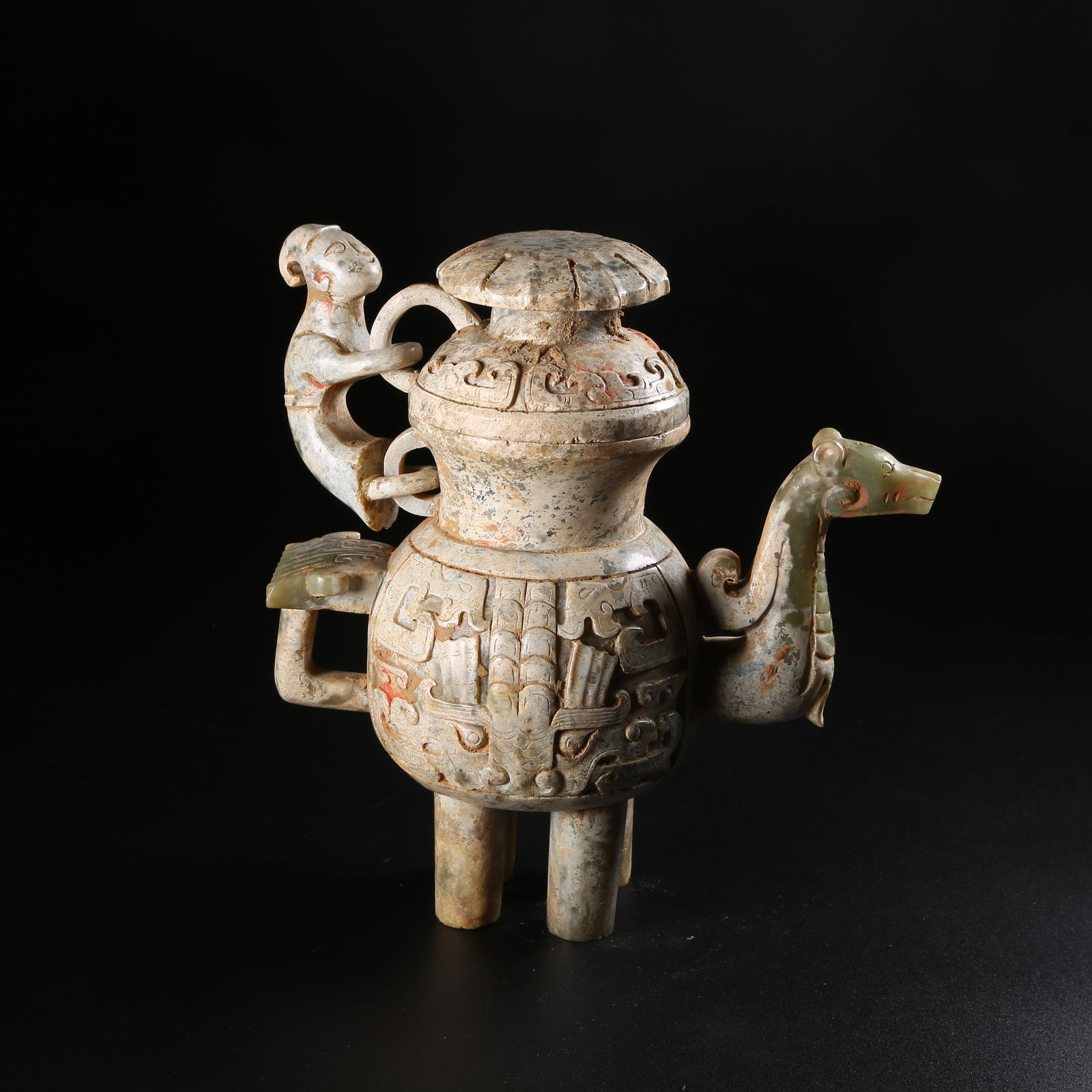 A ARCHAIC JADE EWER WITH BEAST MOTIFS AND MOVABLE RING HANDLE (1 of 9)