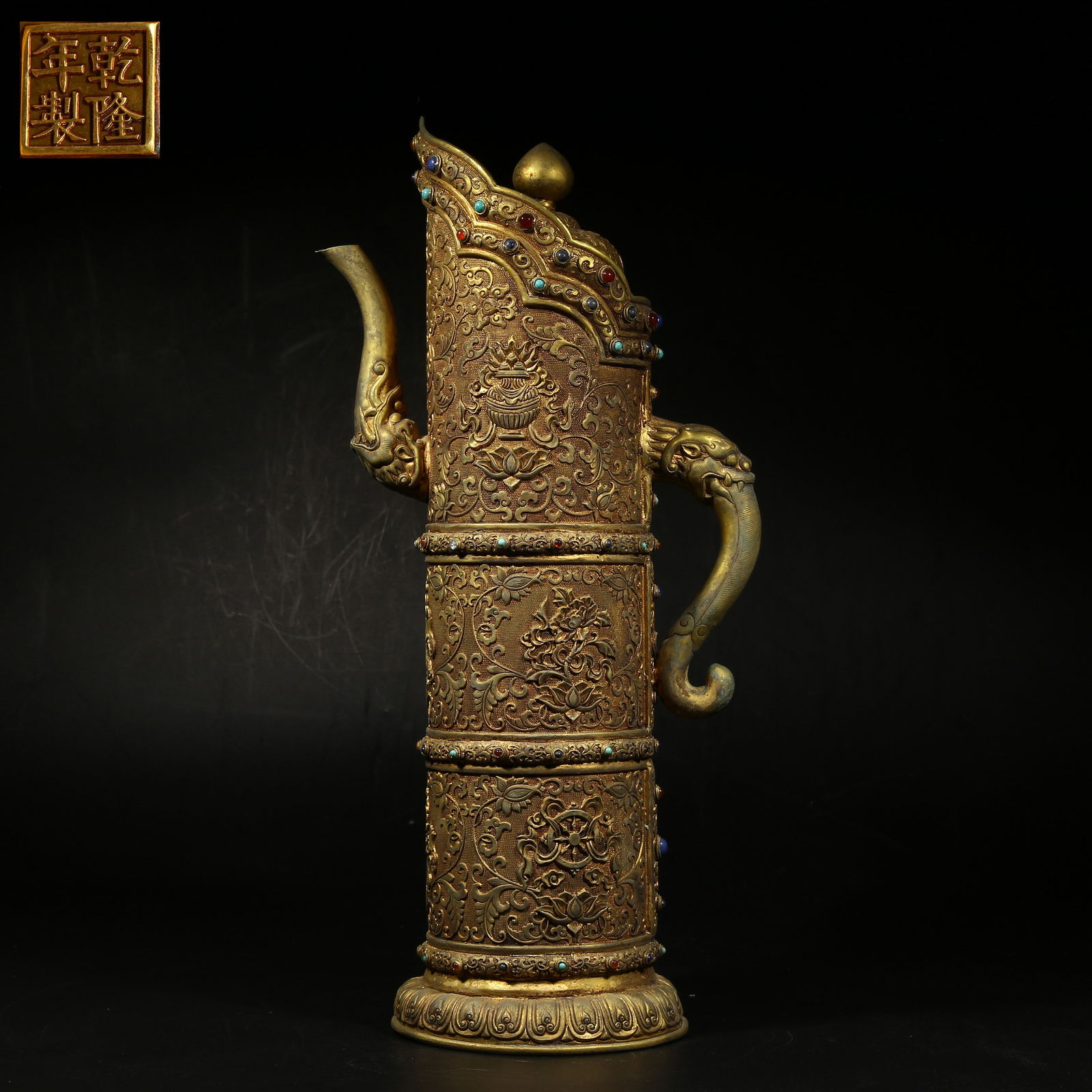 A GILDED BRONZE TIBETAN-STYLE TEAPOT WITH EIGHT AUSPICIOUS SYMBOLS: Gilded bronze Tibetan-style teapot with Eight Auspicious Symbols