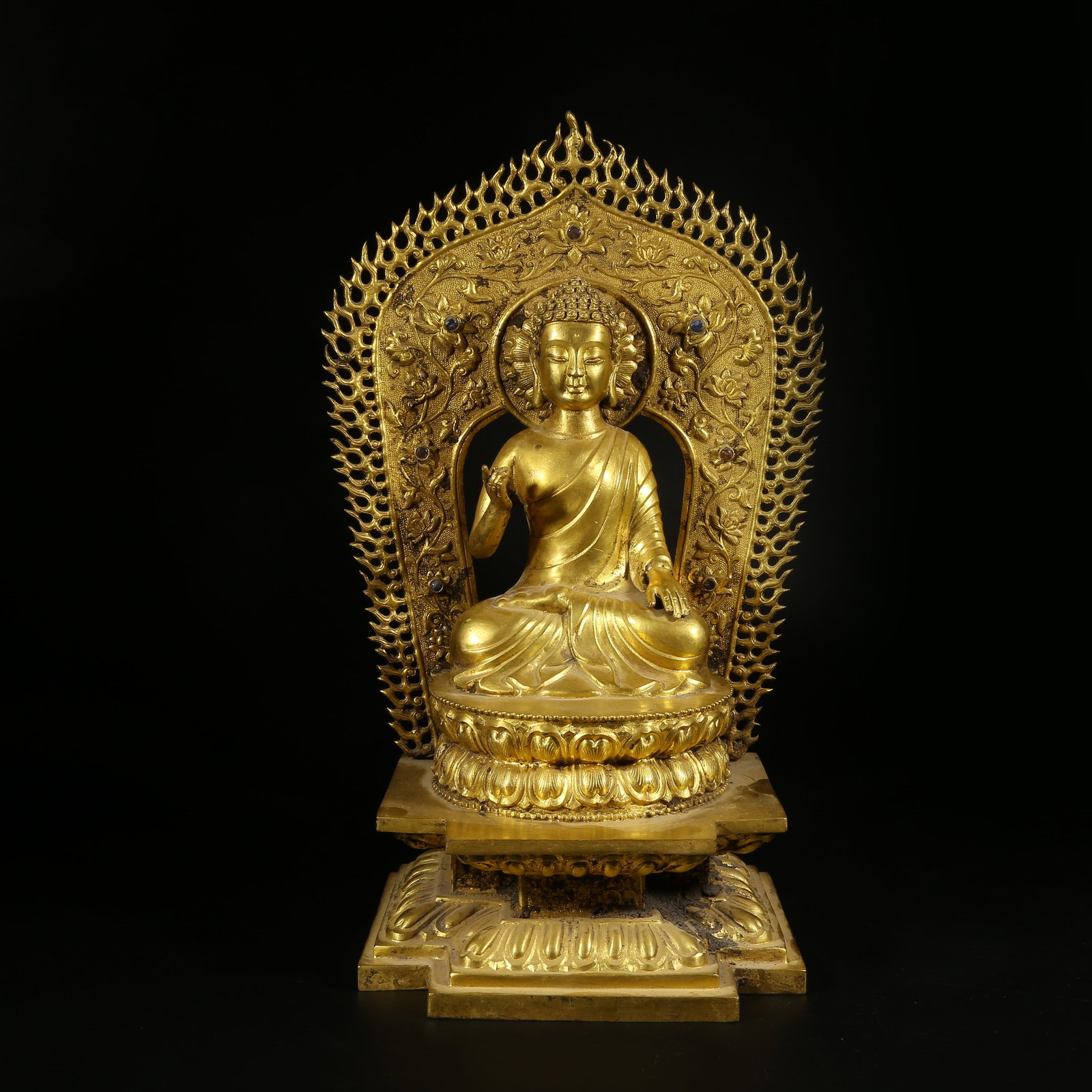 A GILT BRONZE FIGURE OF SHAKYAMUNI BUDDHA: Gilt Bronze Figure of Shakyamuni Buddha