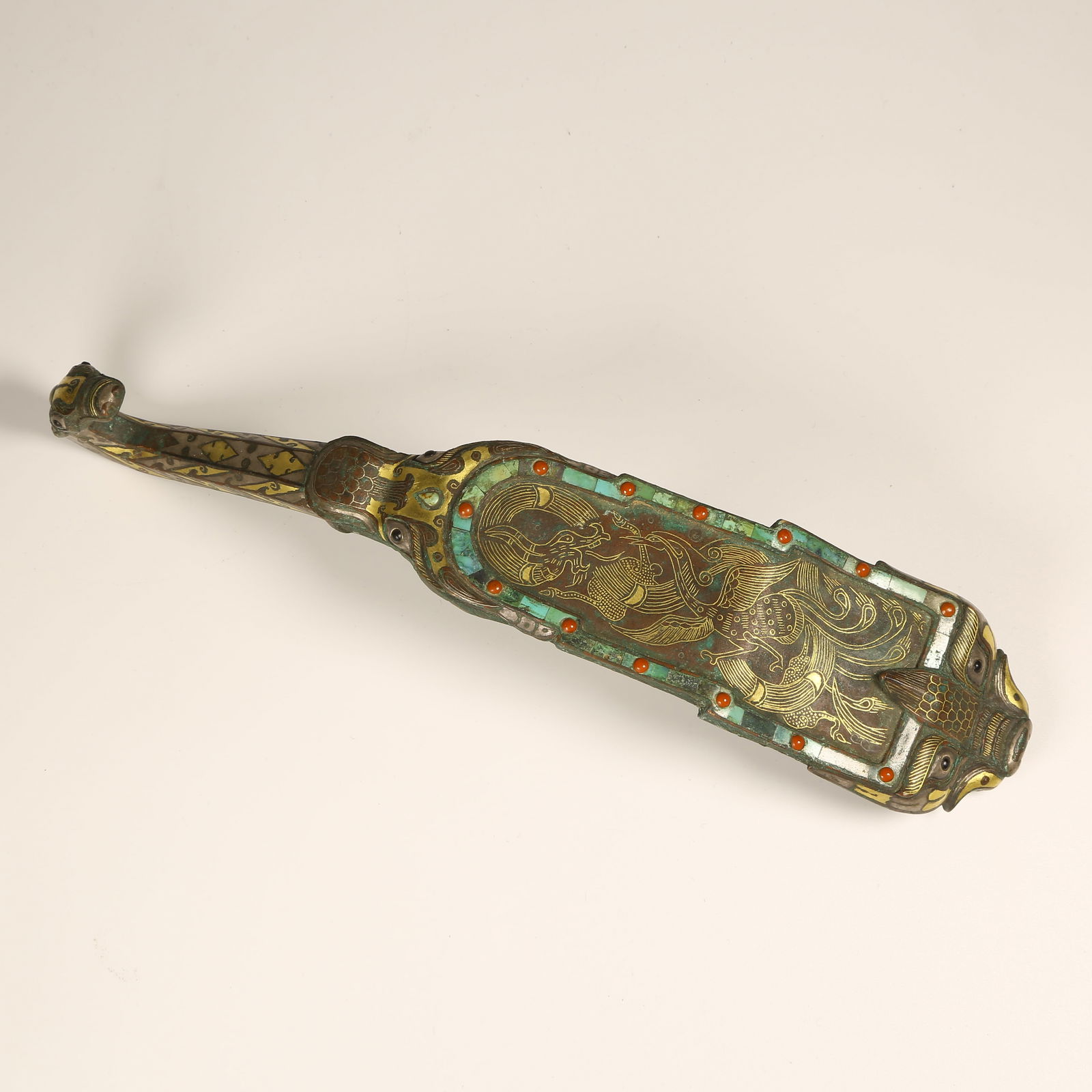 A BRONZE BELT HOOK WITH GOLD-AND-SILVER INLAY, TURQUOISE, AND DRAGON-AND-PHOENIX MOTIFS (1 of 10)