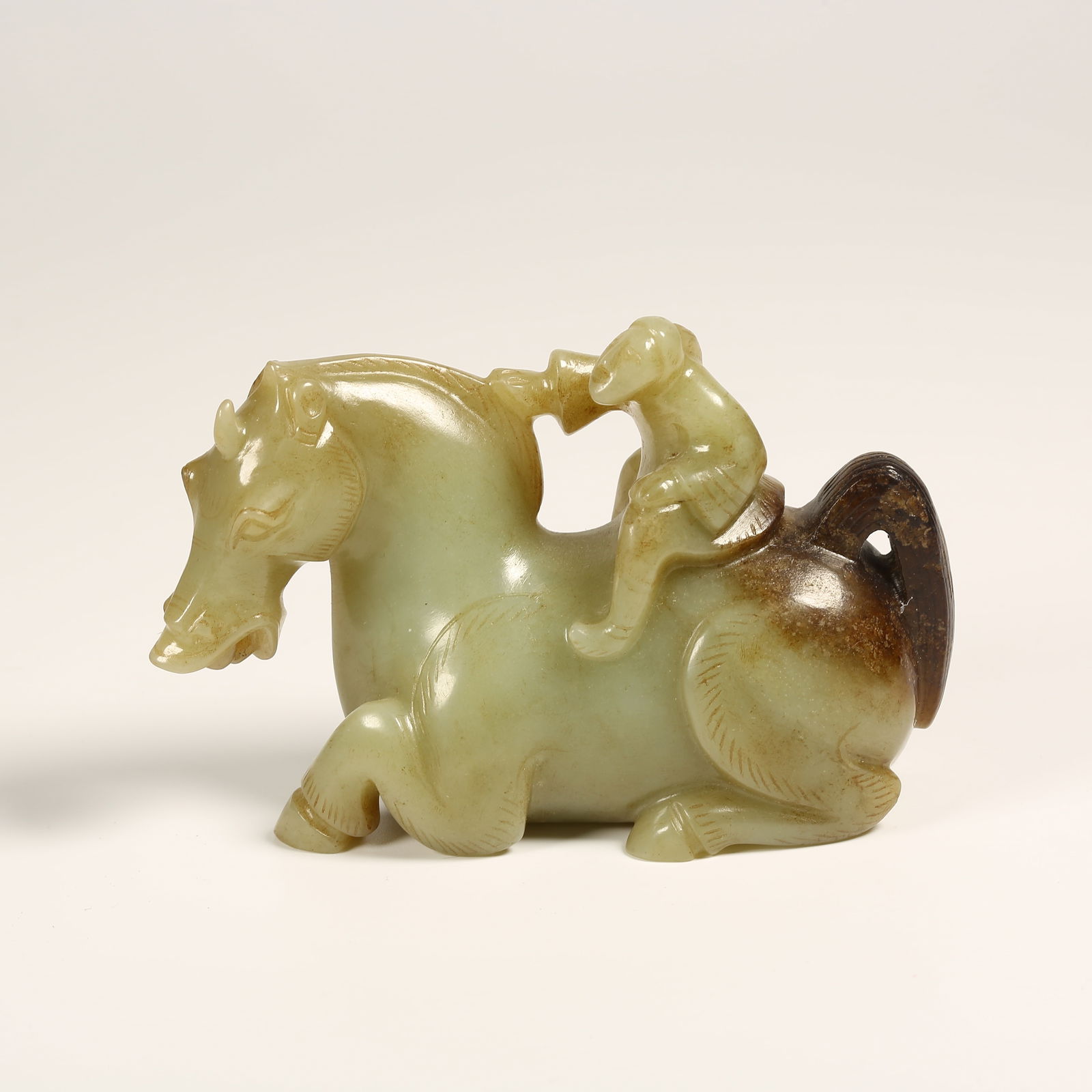 A ARCHAIC JADE RECUMBENT HORSE ORNAMENT (1 of 7)