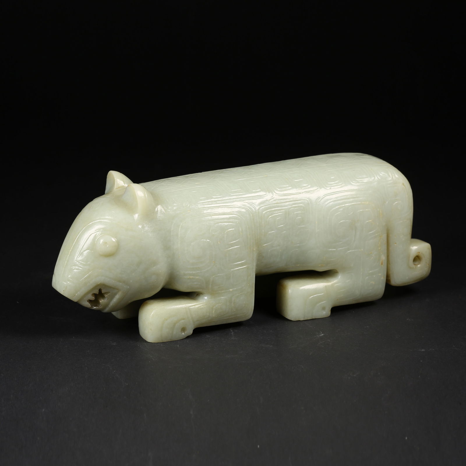 A ARCHAIC JADE AUSPICIOUS BEAST ORNAMENT (1 of 9)