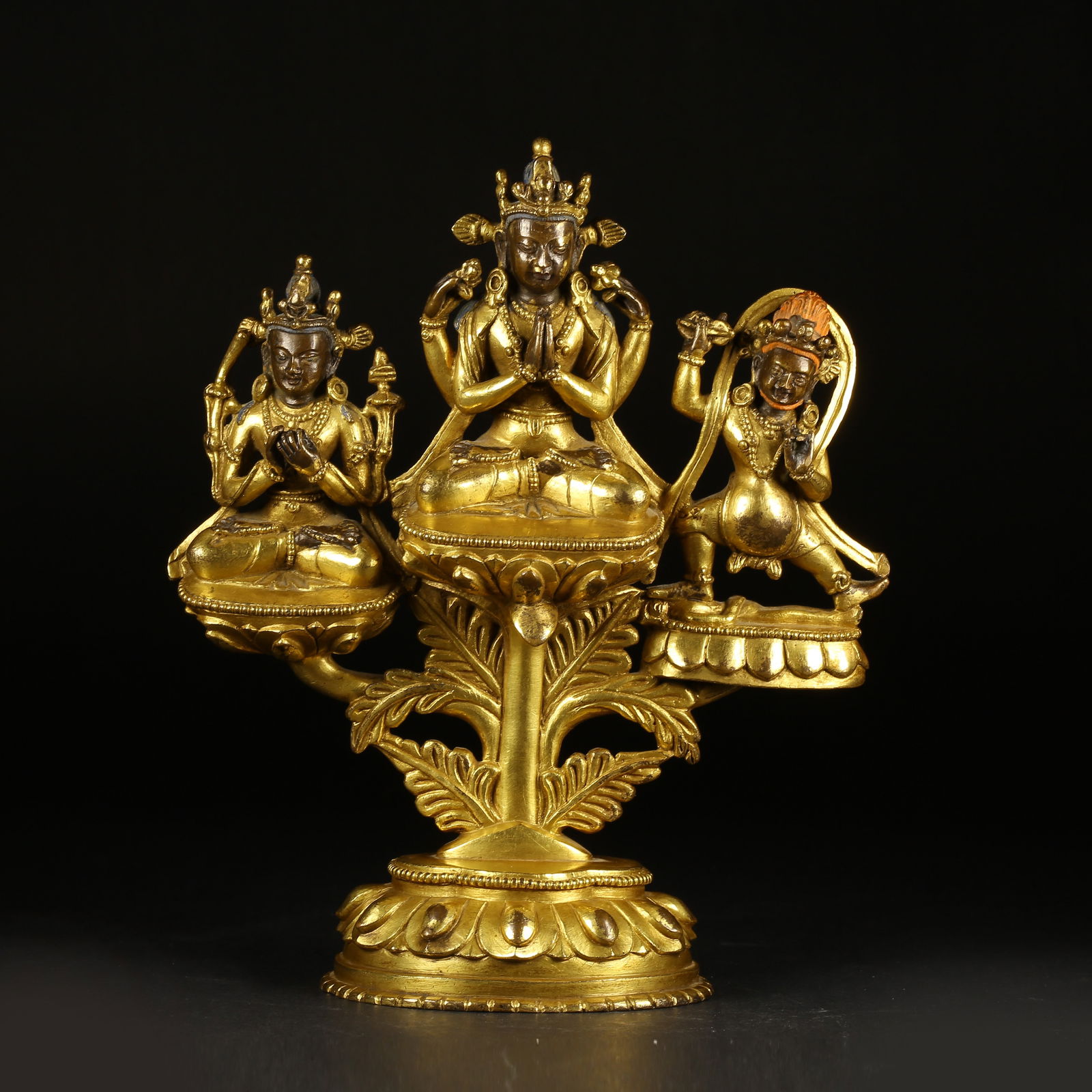 A GILT-BRONZE GROUP OF THE THREE PROTECTORS (1 of 10)
