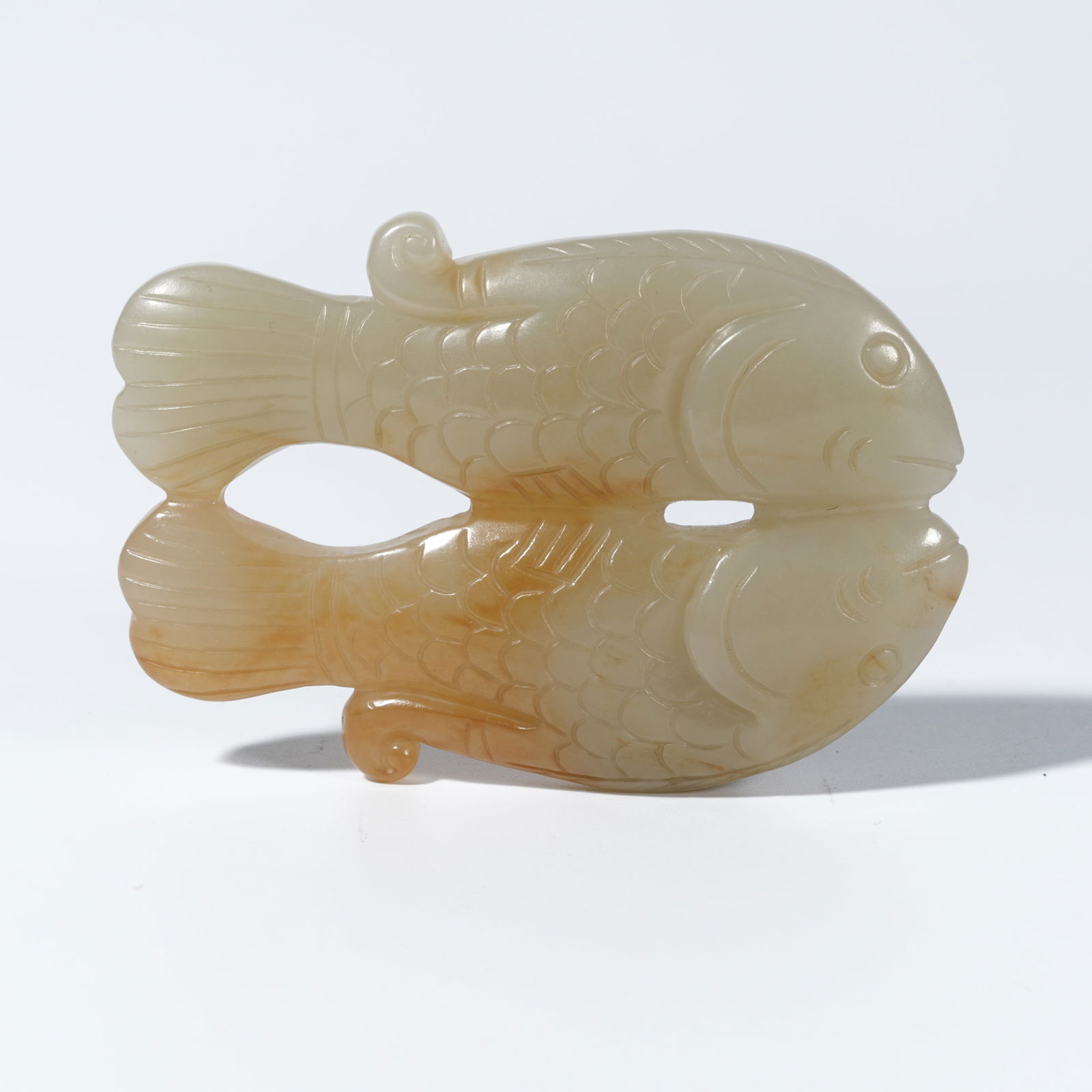 A HETIAN JADE CARVED DOUBLE-FISH FIGURE (1 of 10)