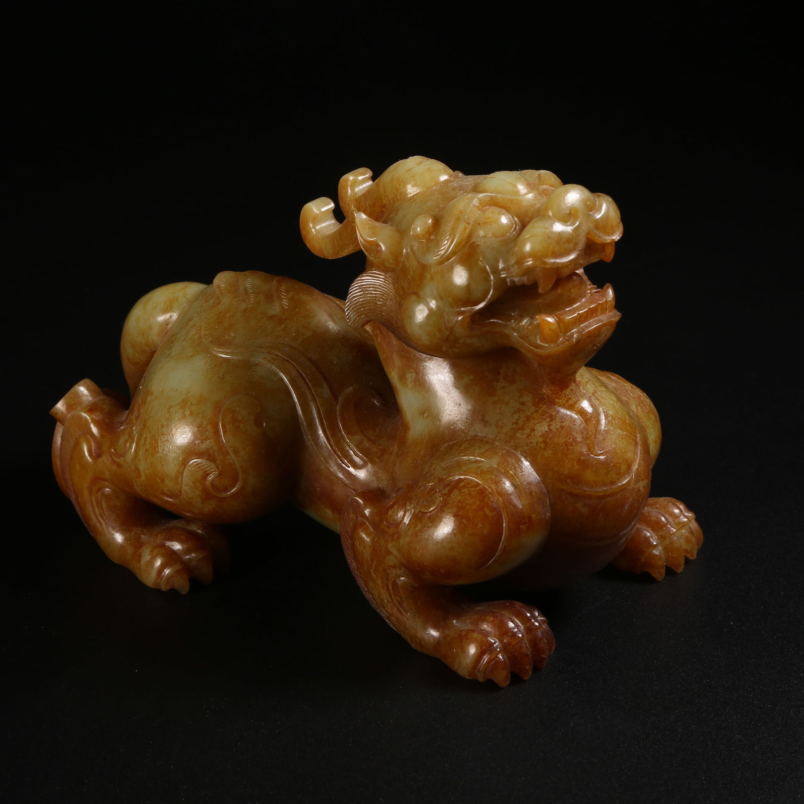 A ARCHAIC JADE AUSPICIOUS BEAST ORNAMENT (1 of 8)