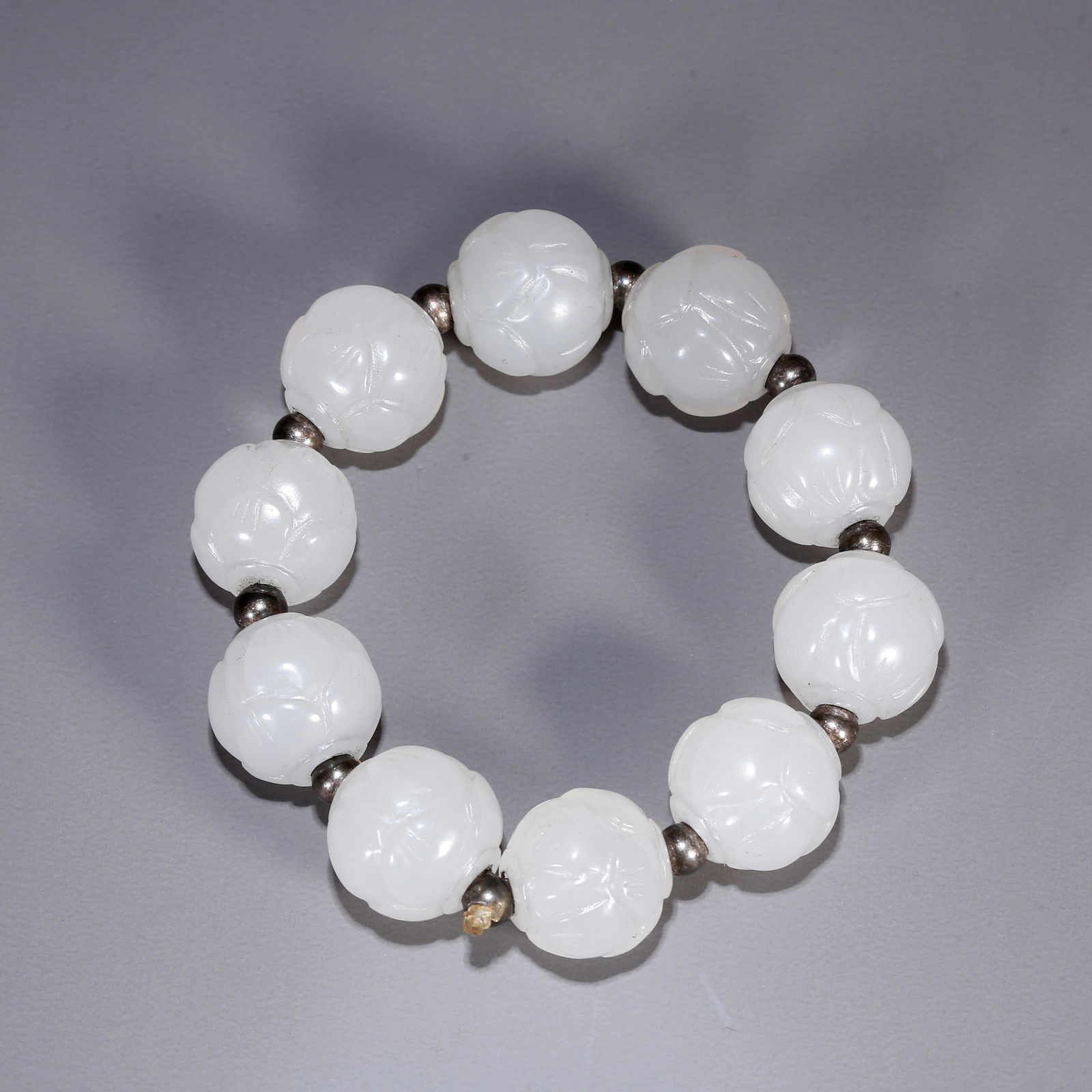 A HETIAN JADE CARVED BEAD BRACELET (1 of 8)