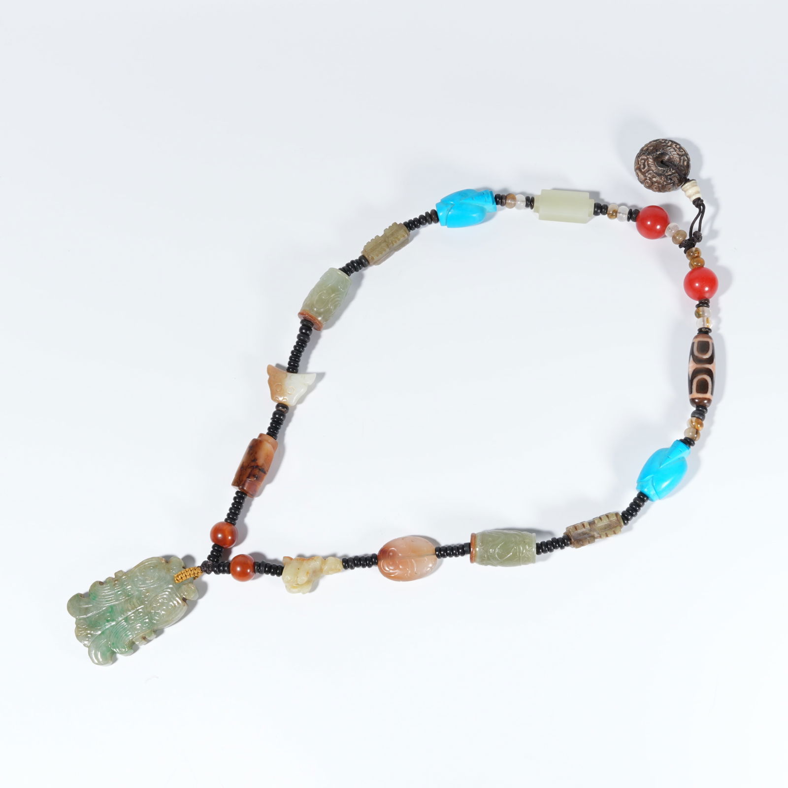 A JADEITE CARVED PENDANT (1 of 10)