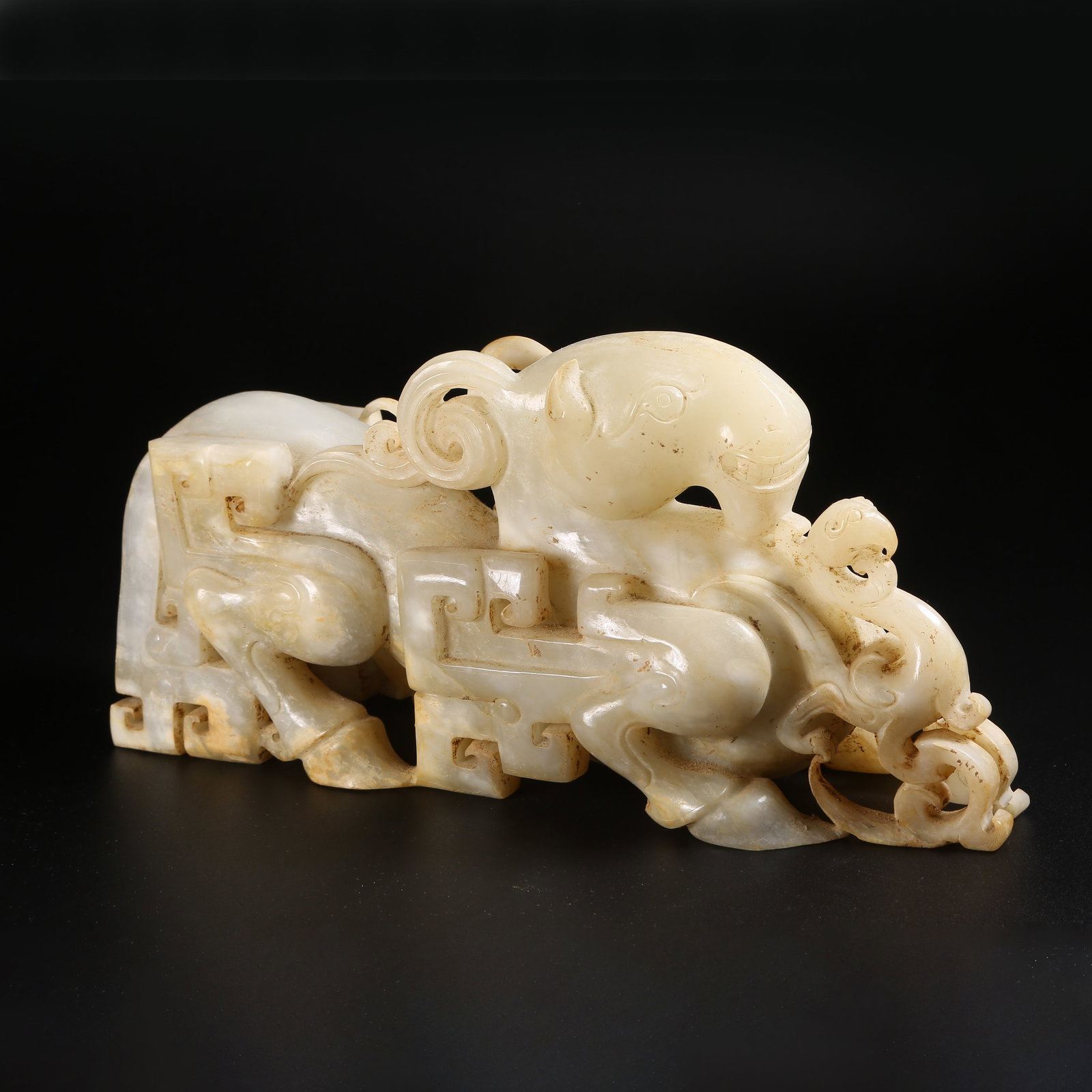 A ARCHAIC JADE AUSPICIOUS BEAST ORNAMENT (1 of 8)