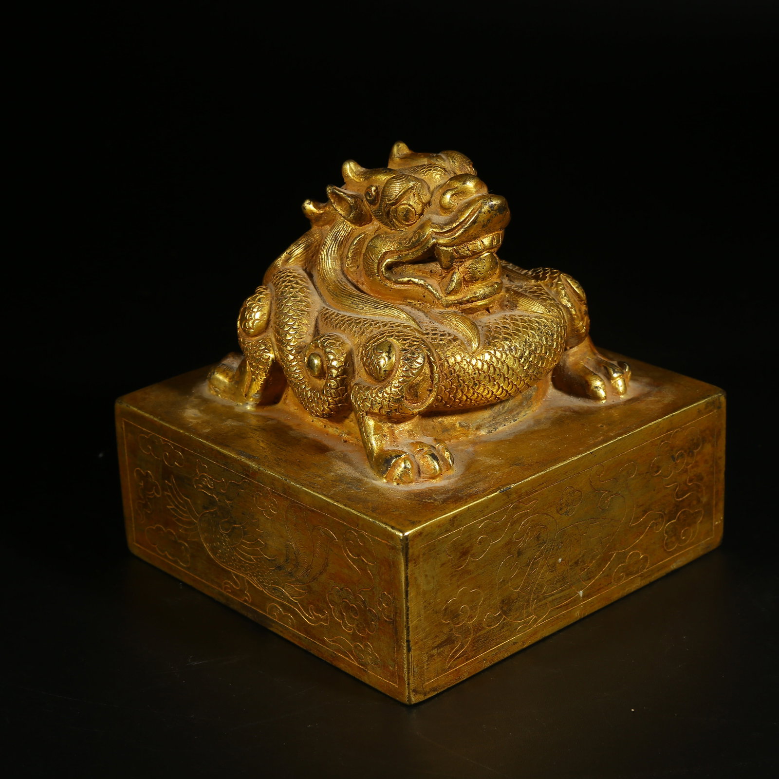 A GILT BRONZE SEAL WITH DRAGON KNOB: Gilt Bronze Seal with Dragon Knob