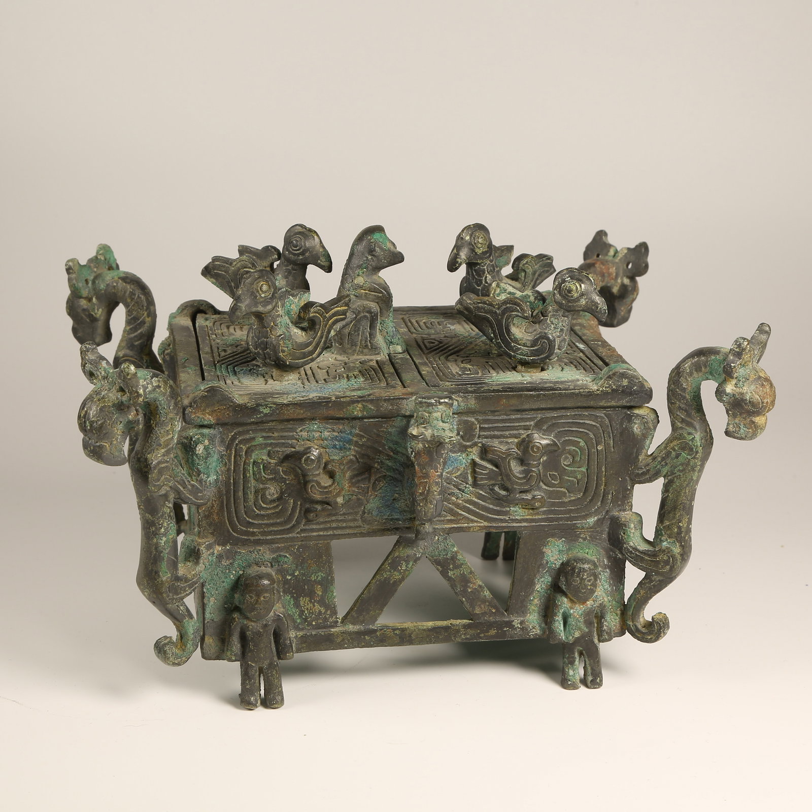 A BRONZE BASE WITH FOUR DRAGONS AND FOUR PHOENIXES: Bronze Base with Four Dragons and Four Phoenixes
