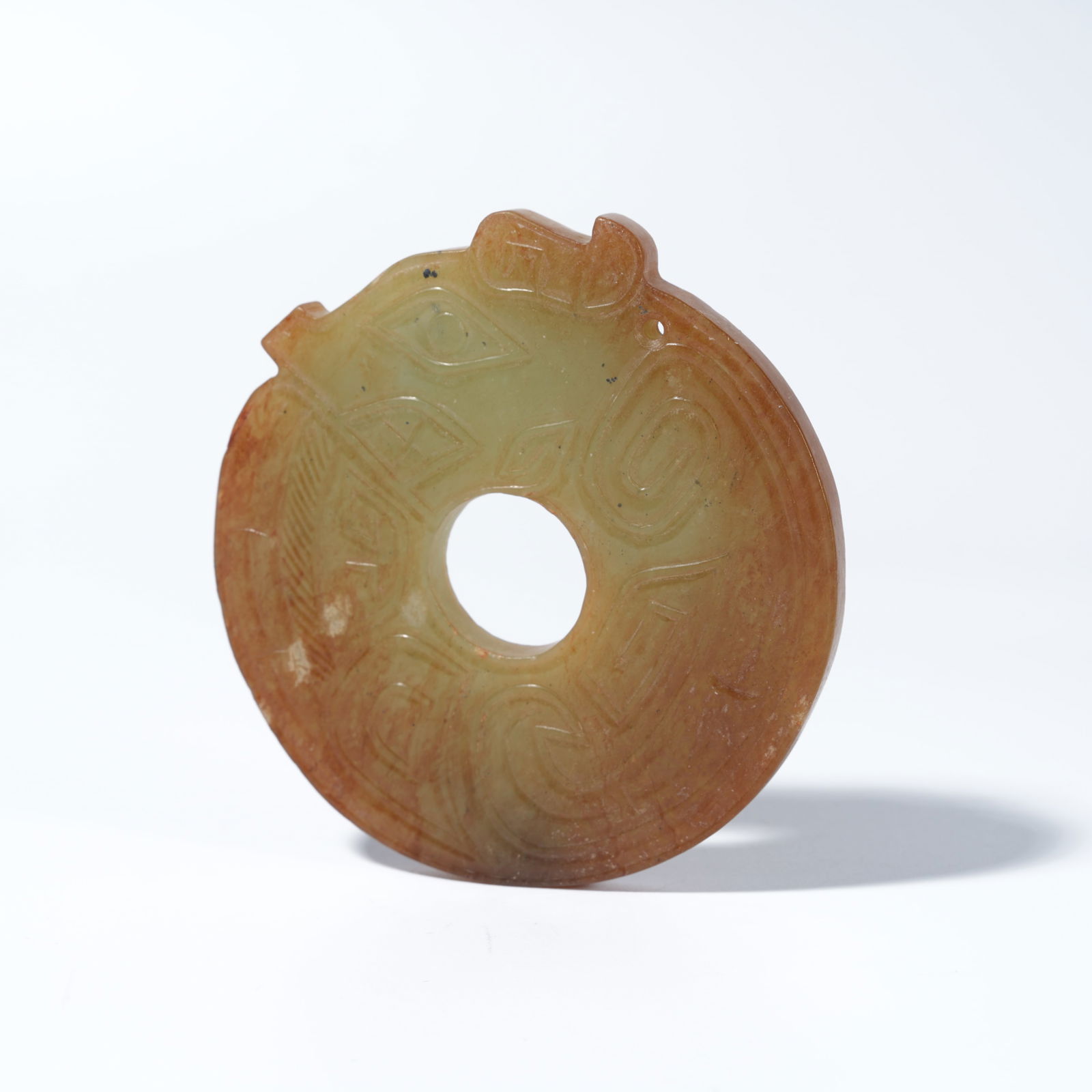 A HETIAN JADE CARVED ANIMAL-MOTIF PENDANT (1 of 9)