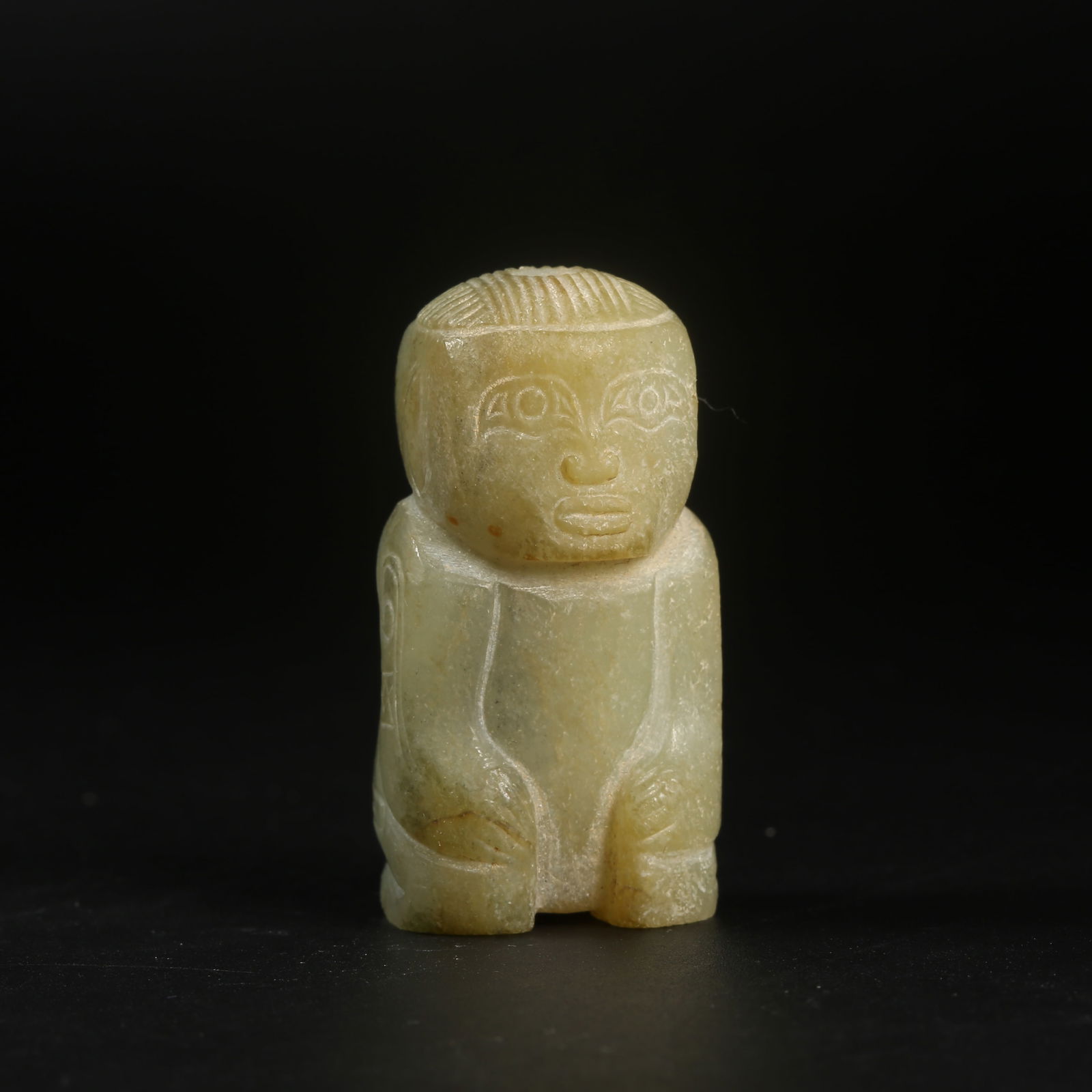 A ARCHAIC JADE KNEELING FIGURE (1 of 8)