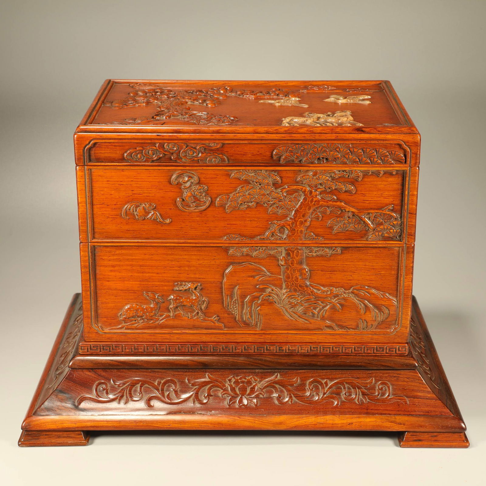 A HUANGHUALI CARVED MULTI-TREASURE BOX WITH CRANE AND DEER IN SPRING MOTIF: Huanghuali Carved Multi-Treasure Box with Crane and Deer in Spring Motif