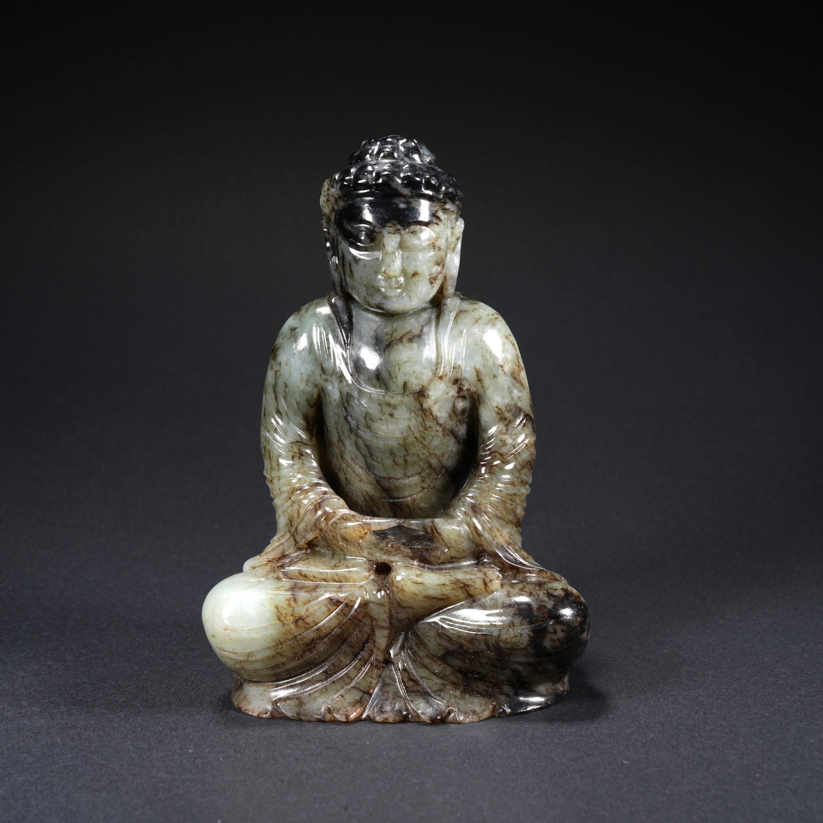 A HETIAN JADE CARVED BUDDHA FIGURE: Hetian Jade Carved Buddha Figure