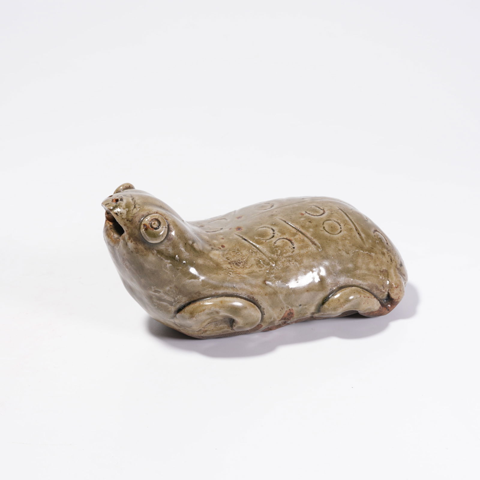 A YAOZHOU KILN FROG-SHAPED FIGURINE: Yaozhou Kiln Frog-Shaped Figurine