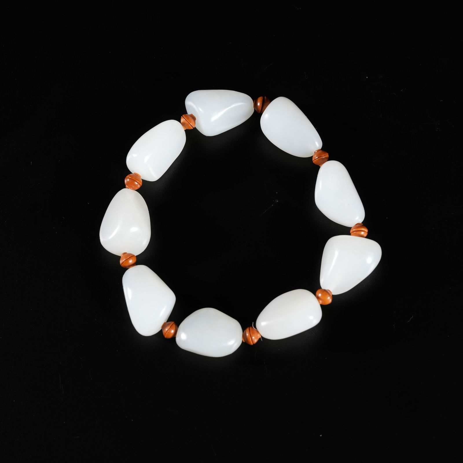 A HETIAN JADE CARVED BEAD BRACELET (1 of 8)