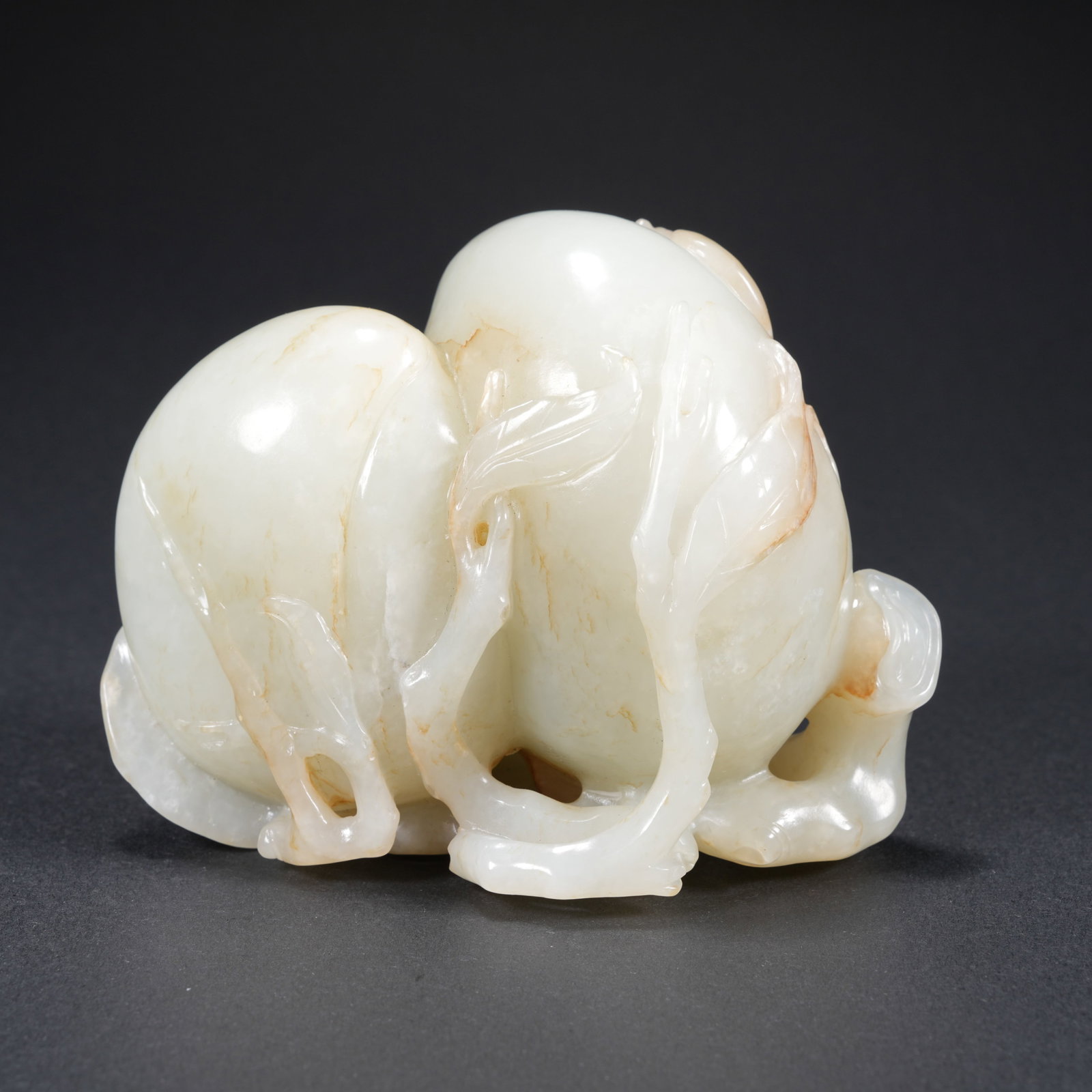 A HETIAN JADE CARVED LONGEVITY-PEACH FIGURE: Hetian Jade Carved Longevity-Peach Figure