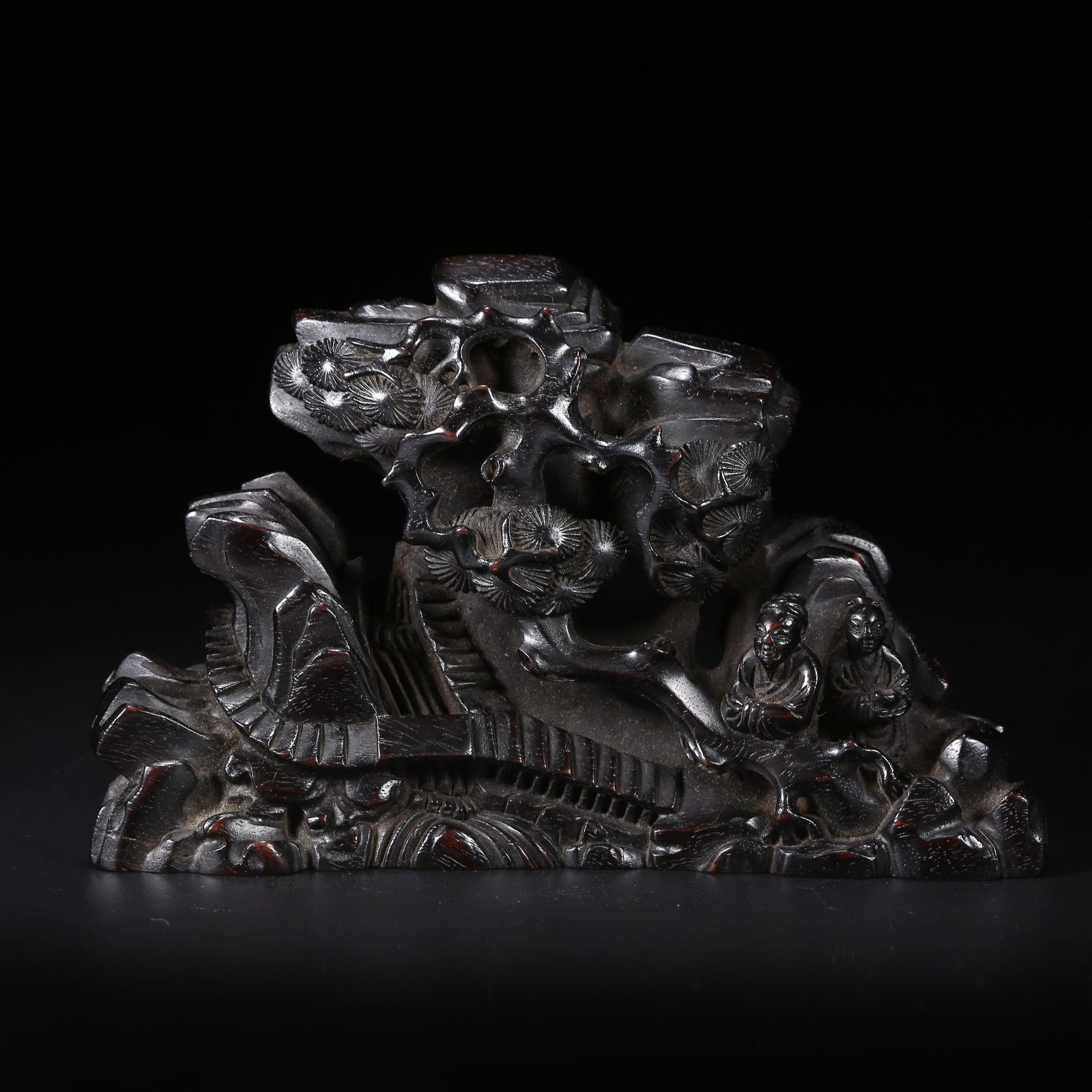 A ZITAN MOUNTAIN-SHAPED ORNAMENT WITH SCHOLAR UNDER PINE SCENE: Zitan Mountain-shaped Ornament with Scholar under Pine Scene