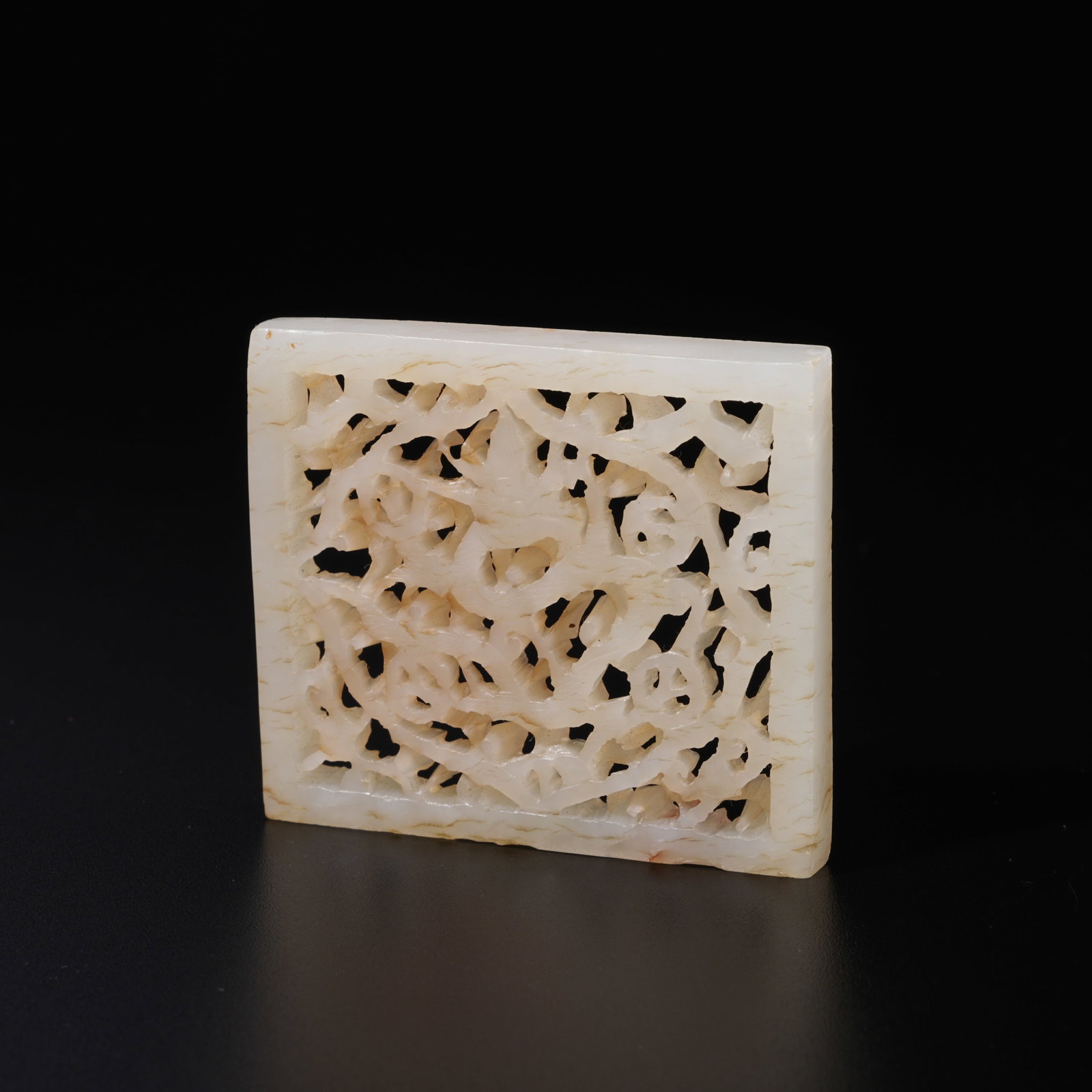 A HETIAN JADE CARVED FLORAL–PATTERN ORNAMENT: Hetian Jade Carved Floral–Pattern Ornament