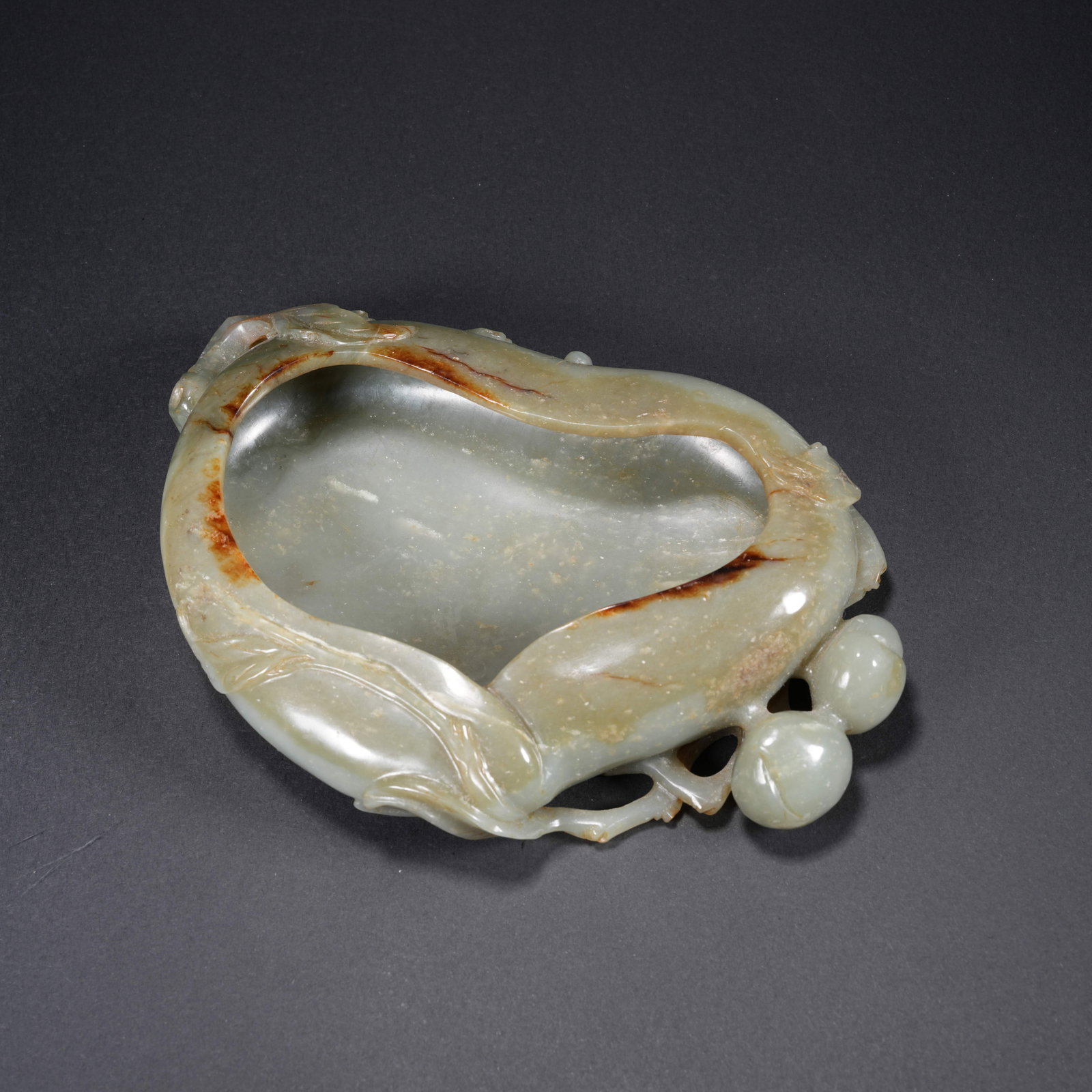 A HETIAN JADE CARVED PEACH-FORM WASH BASIN: Hetian Jade Carved Peach-Form Wash Basin