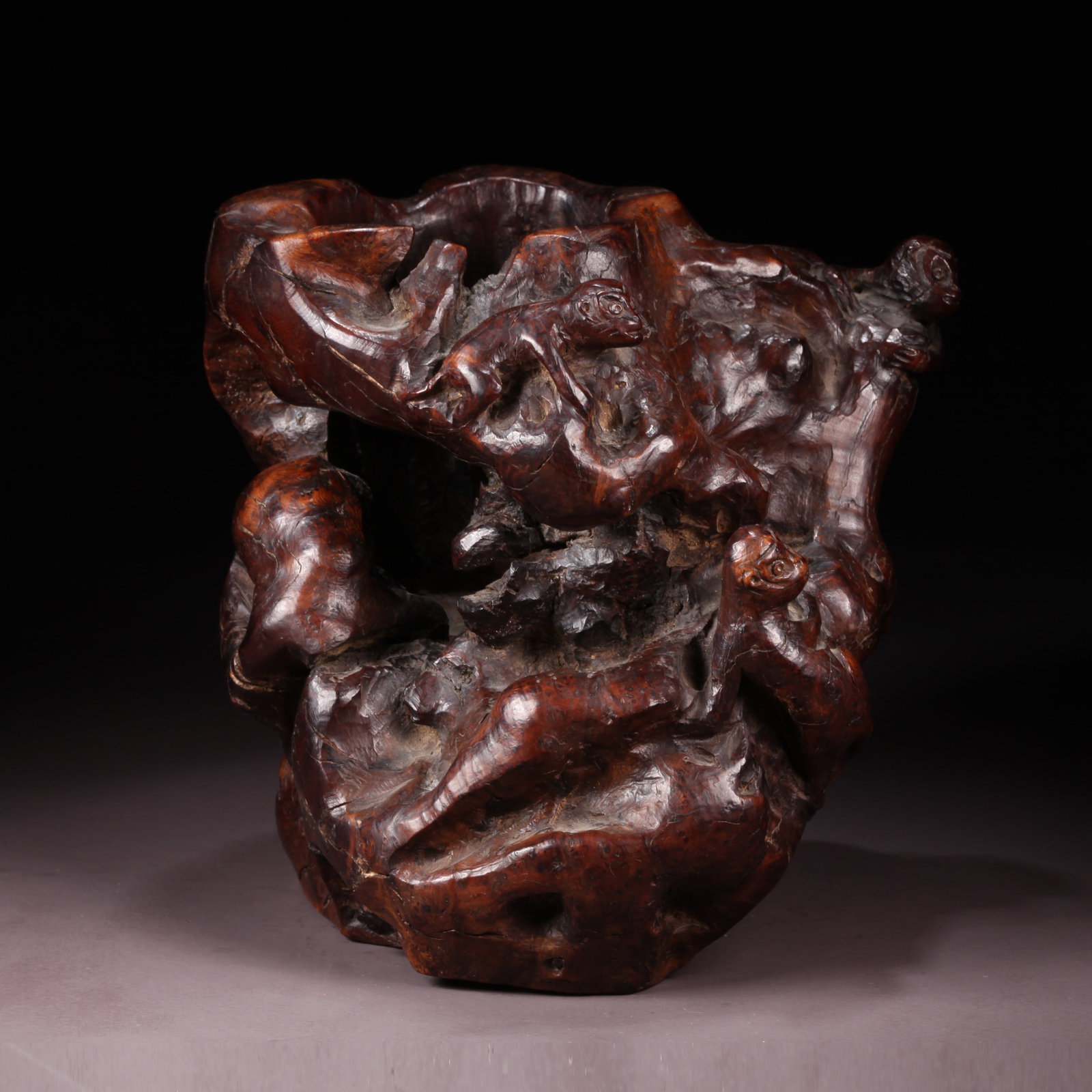 A BURL WOOD BRUSH POT WITH SPIRIT MONKEY PATTERN: Burl Wood Brush Pot with Spirit Monkey Pattern