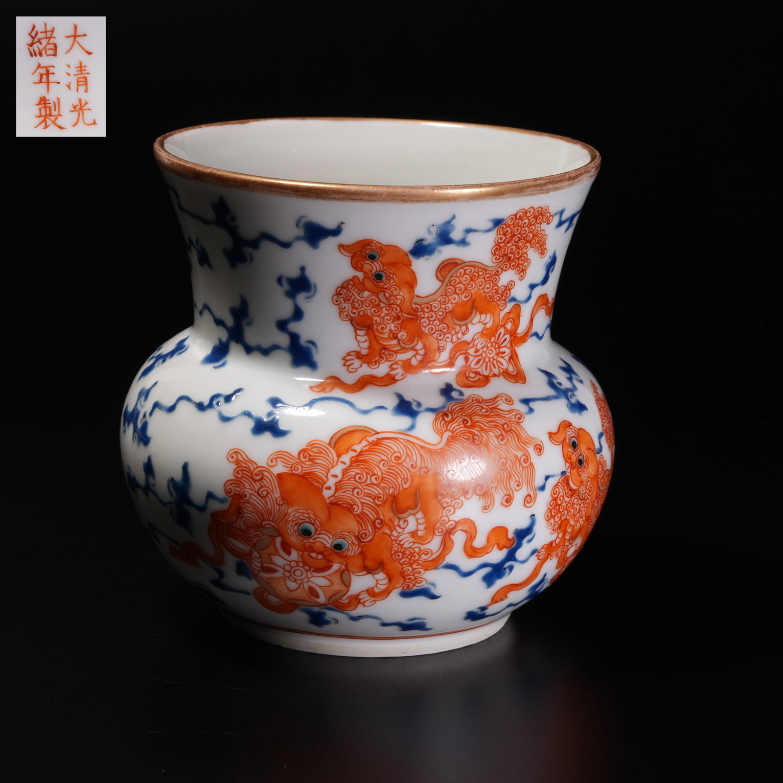A BLUE-AND-WHITE UNDERGLAZE RED CUP WITH LIONS PLAYING WITH BALL PATTERN AND STRAINER: Blue-and-White Underglaze Red Cup with Lions Playing with Ball Pattern and Strainer