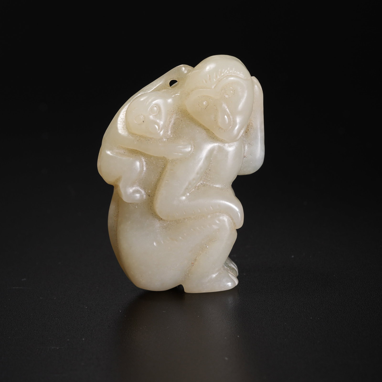 A HETIAN JADE PENDANT IN THE SHAPE OF A MONKEY (1 of 9)