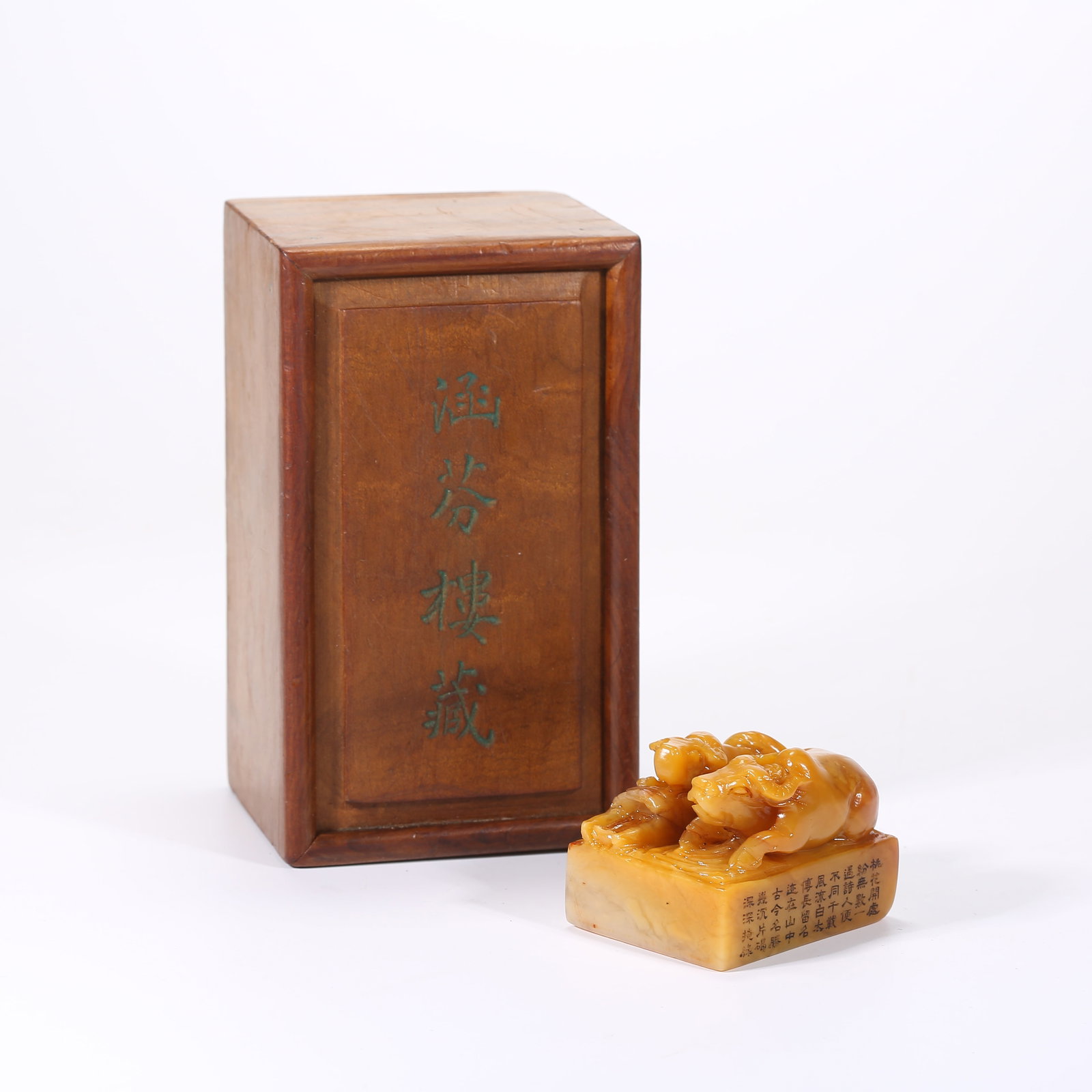 A SHOUSHAN TIANHUANG STONE SEAL WITH CATTLE-HERDING FINIAL: Shoushan Tianhuang stone seal with cattle-herding finial