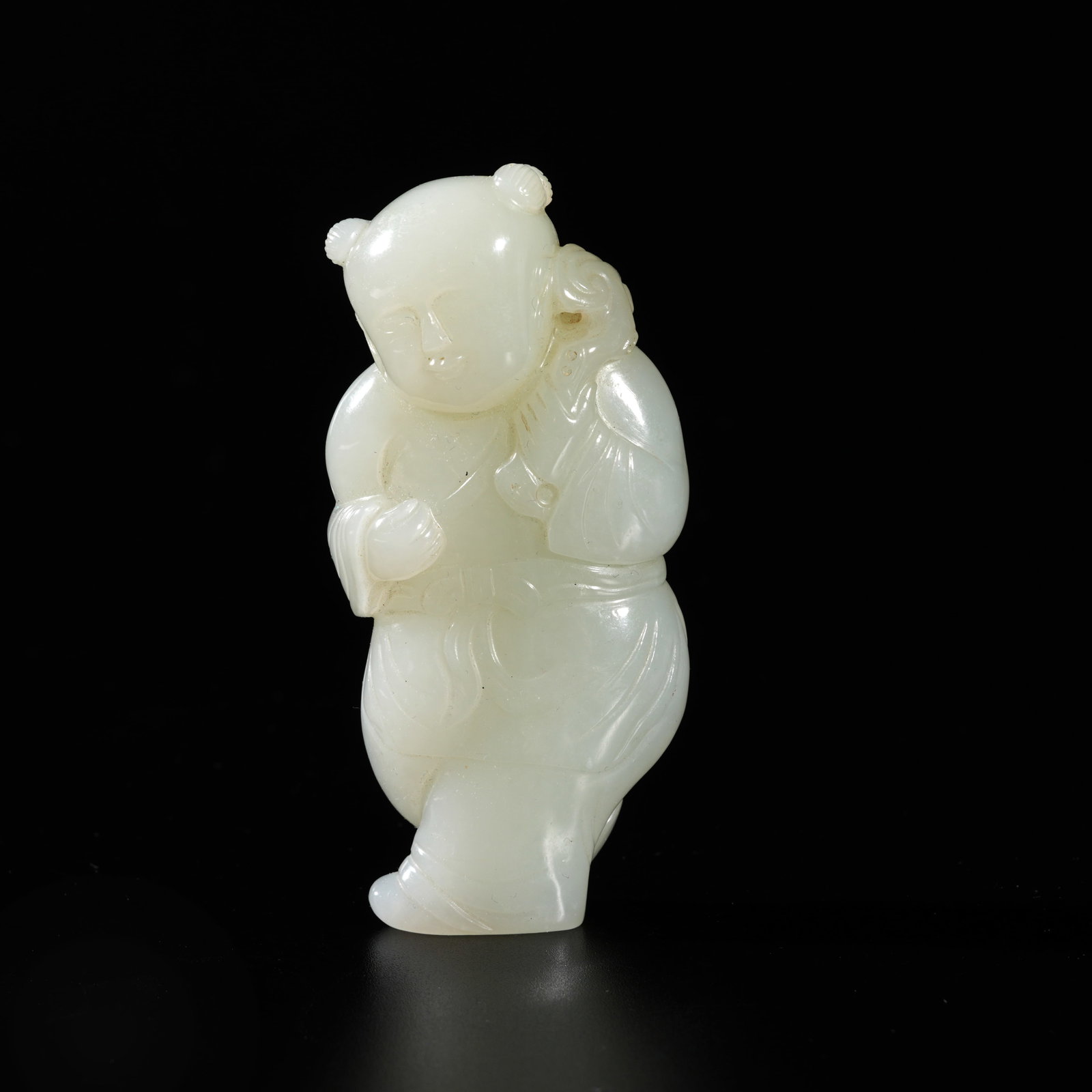 A HETIAN JADE CARVED BOY-FORM ORNAMENT: Hetian Jade Carved Boy-Form Ornament