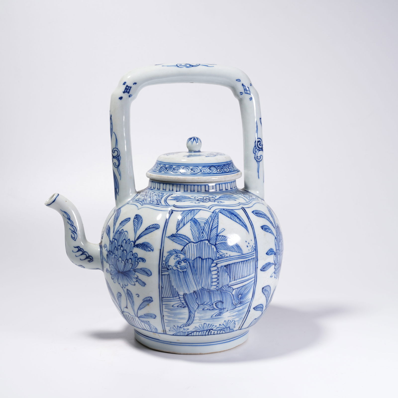 A BLUE-AND-WHITE TEAPOT WITH FLORAL PATTERN (1 of 10)