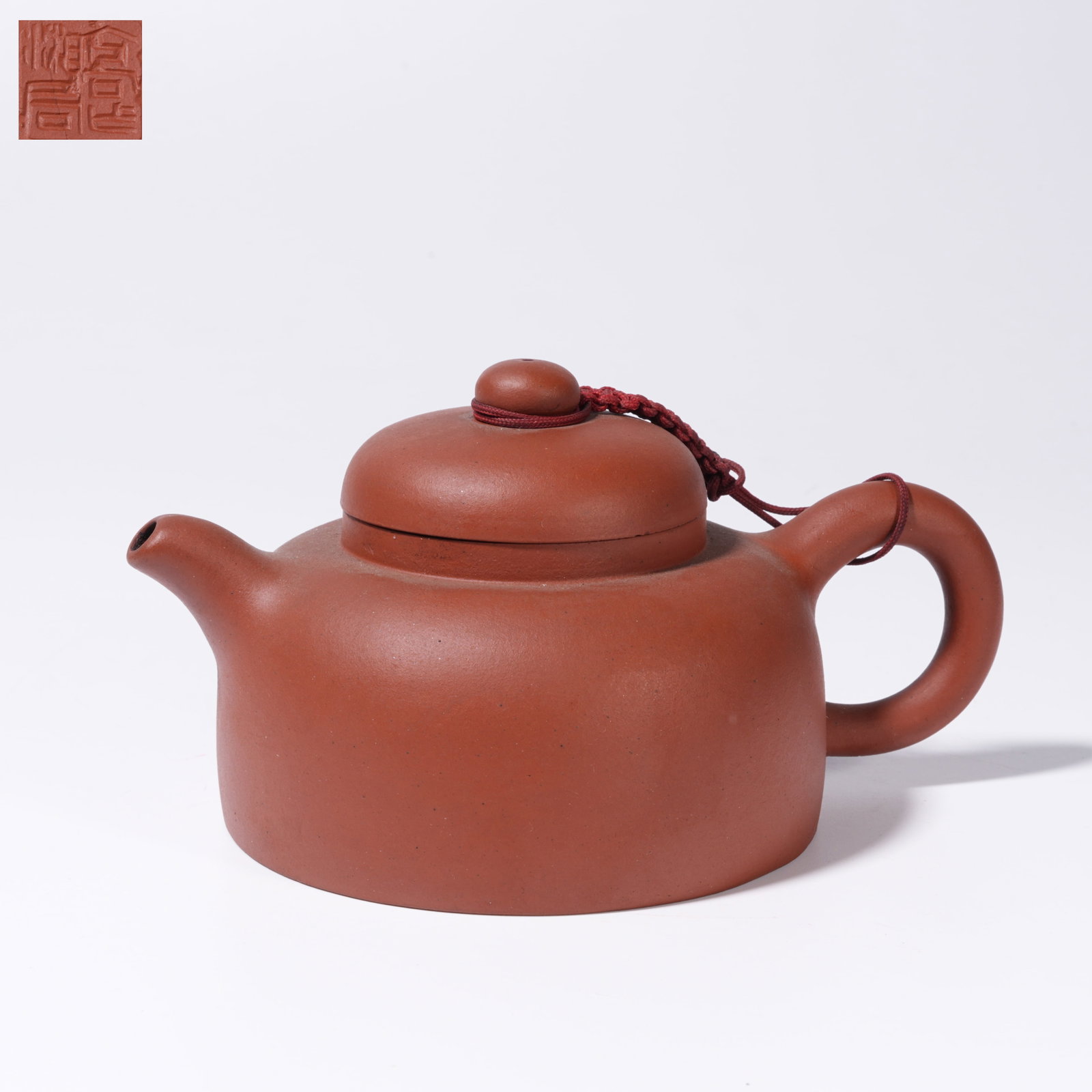 A PURPLE SAND CARVED TEAPOT: Purple Sand Carved Teapot