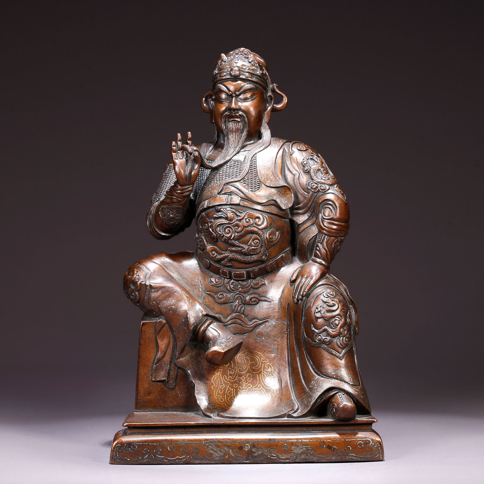 A BRONZE STATUE OF GUAN YU INLAID WITH GOLD AND SILVER: Bronze Statue of Guan Yu Inlaid with Gold and Silver
